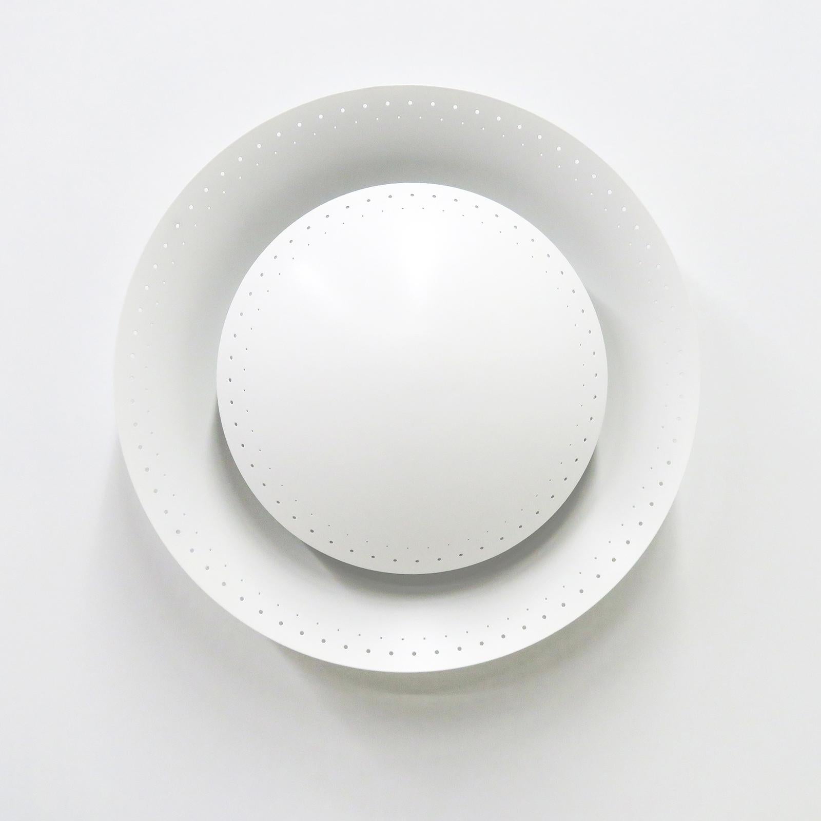 Elegant custom 'Oculus' wall or ceiling light designed by Gallery L7, handcrafted and finished in Los Angeles from American brass, with a satin white perforated shade over a white enameled perforated disc, three E26 sockets per fixture, max. wattage