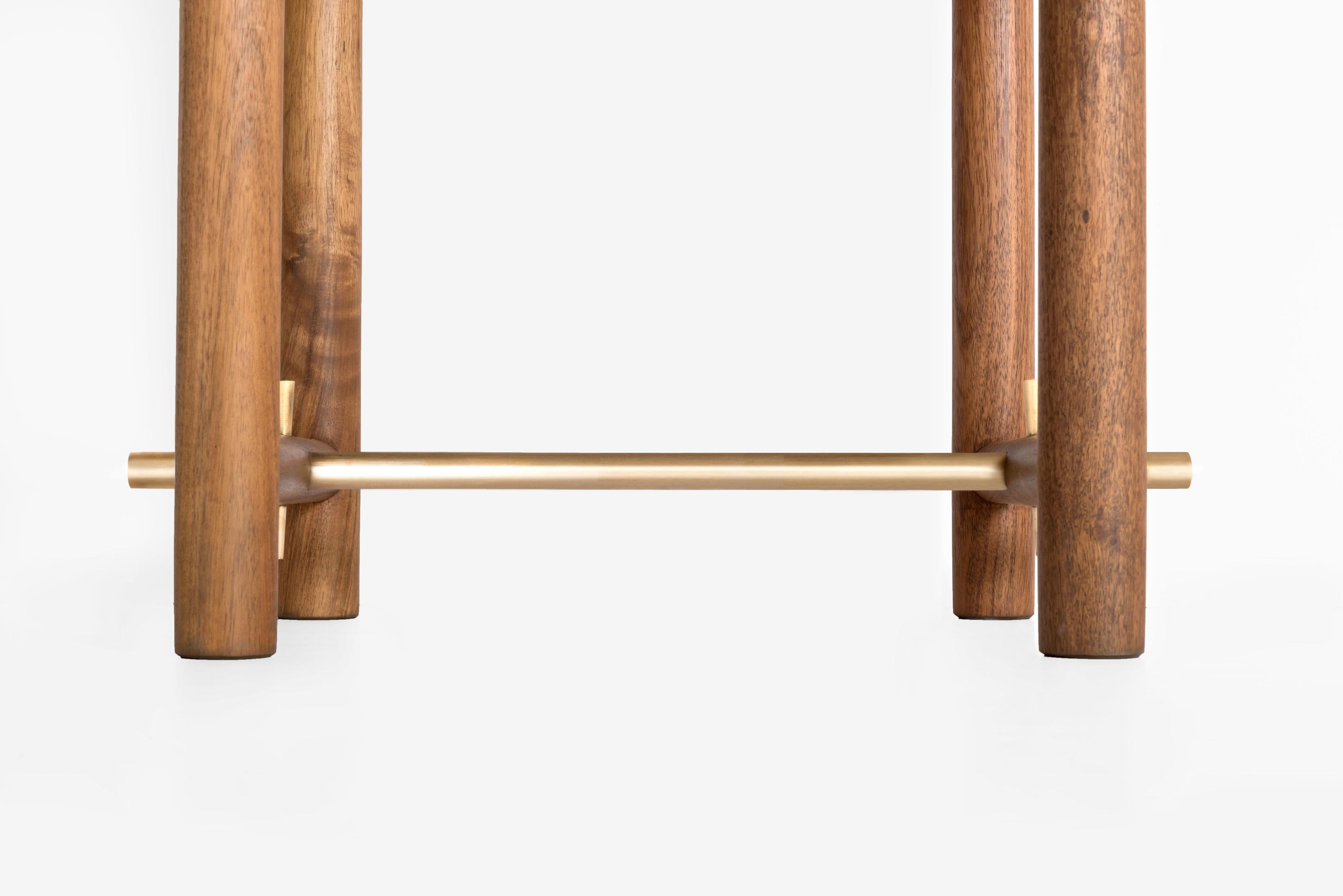The design of Ocum Nightstand is typified by the search for balanced proportions, simplicity of the basic forms and minimalist construction. The contrasting textures of the Caribbean Walnut and the bronze details give it lots of personality.