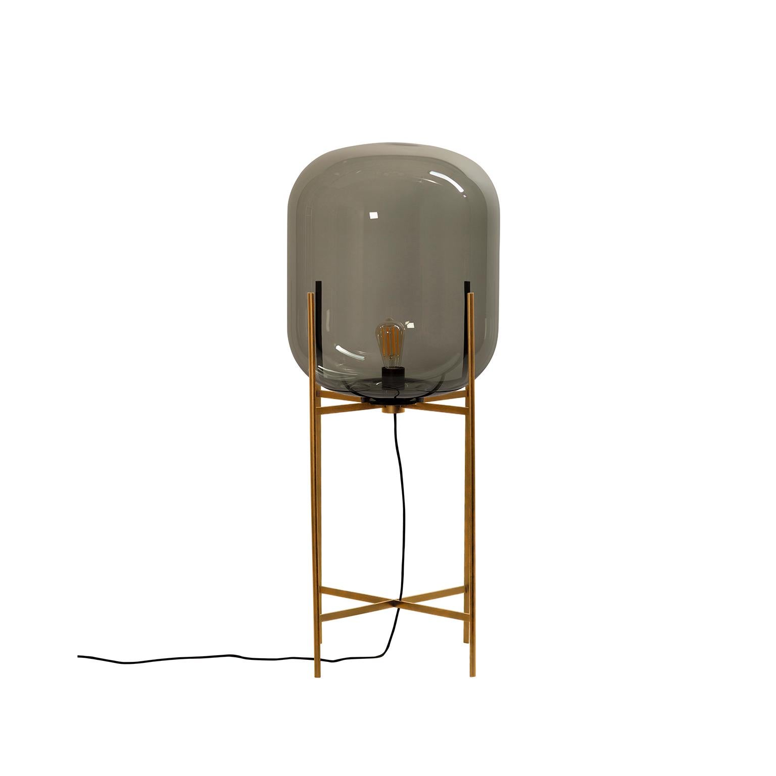 Oda floor lamp, European, Minimalist, steel grey, brass base, German, lamp, 21st century, in between size

Directly inspired by the industrial monuments photographed by the famous artists Bernd and Hilla Becher, Sebastian Herkner bundles up their