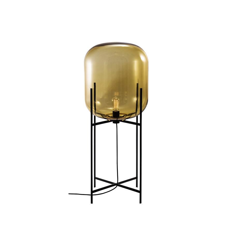 Oda In Between Amber Black Floor Lamp by Pulpo
Dimensions: D45 x H111.2 cm
Materials: handblown glass coloured and steel.

Also available in different finishes. Please contact us.

A slender base hugs a bulbous form. An industrial motif softened by