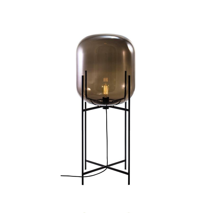 Oda in between smoky grey black floor lamp by Pulpo
Dimensions: D 45 x H 111.2 cm
Materials: hand blown glass coloured and steel.

Also available in different finishes.

A slender base hugs a bulbous form. An Industrial motif softened by the