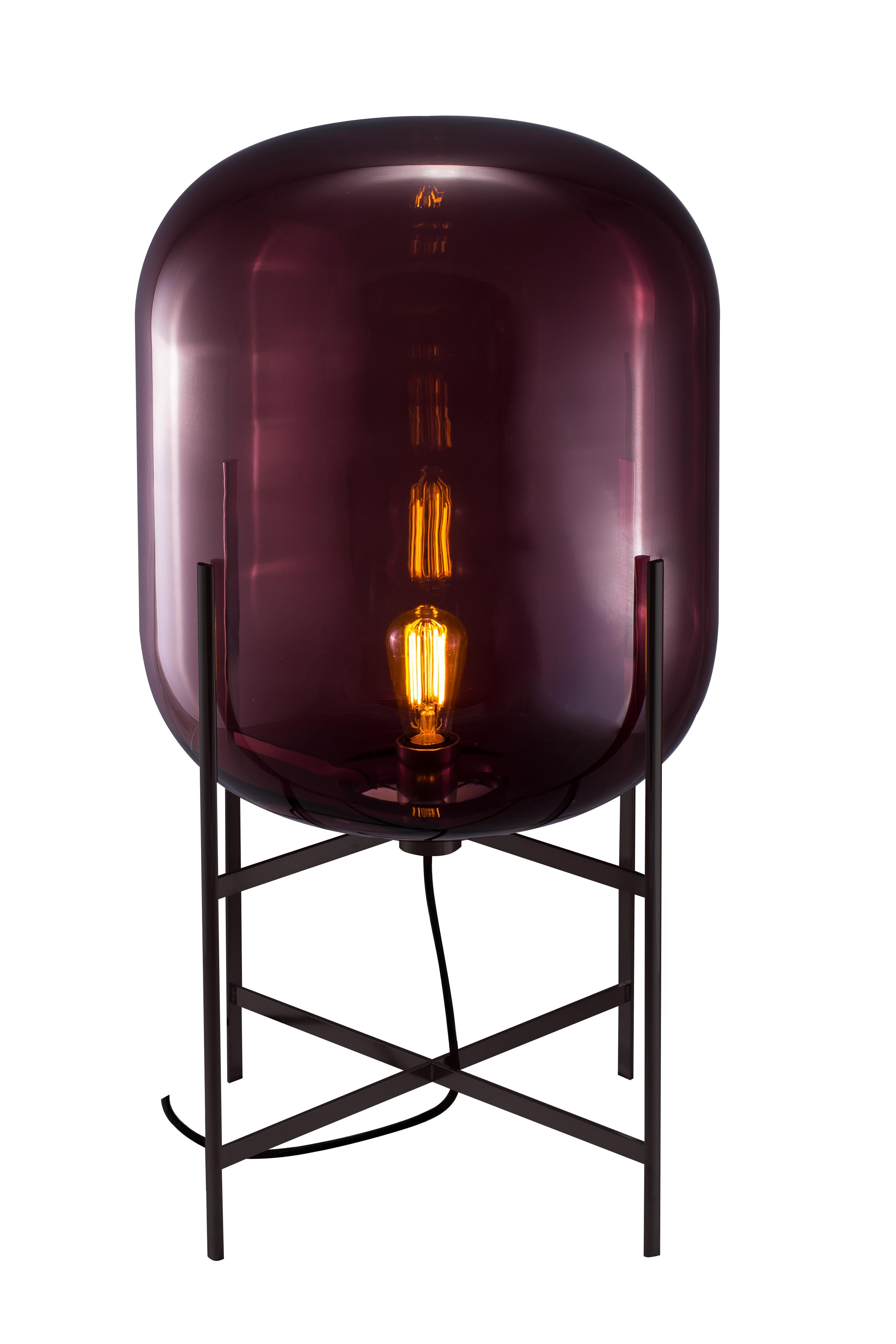 Oda Medium Aubergine Black Floor Lamp by Pulpo
Dimensions: D45 x H80 cm
Materials: handblown glass coloured and steel.

Also available in different finishes.

A slender base hugs a bulbous form. An industrial motif softened by the gentle