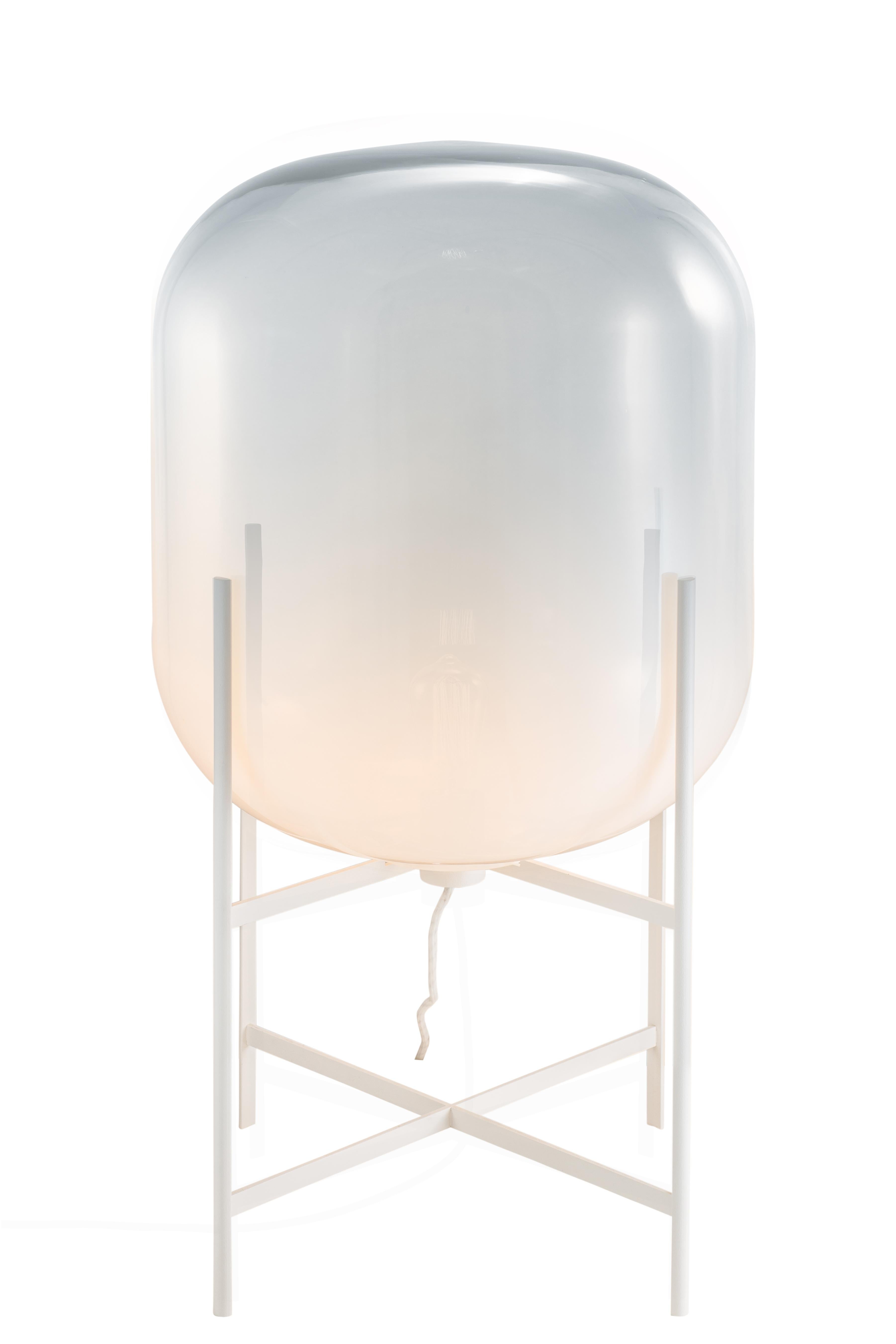 Oda Medium Moonlight White Floor Lamp by Pulpo
Dimensions: D45 x H80 cm
Materials: handblown glass coloured and steel.

Also available in different finishes. Please contact us.

A slender base hugs a bulbous form. An industrial motif softened by the