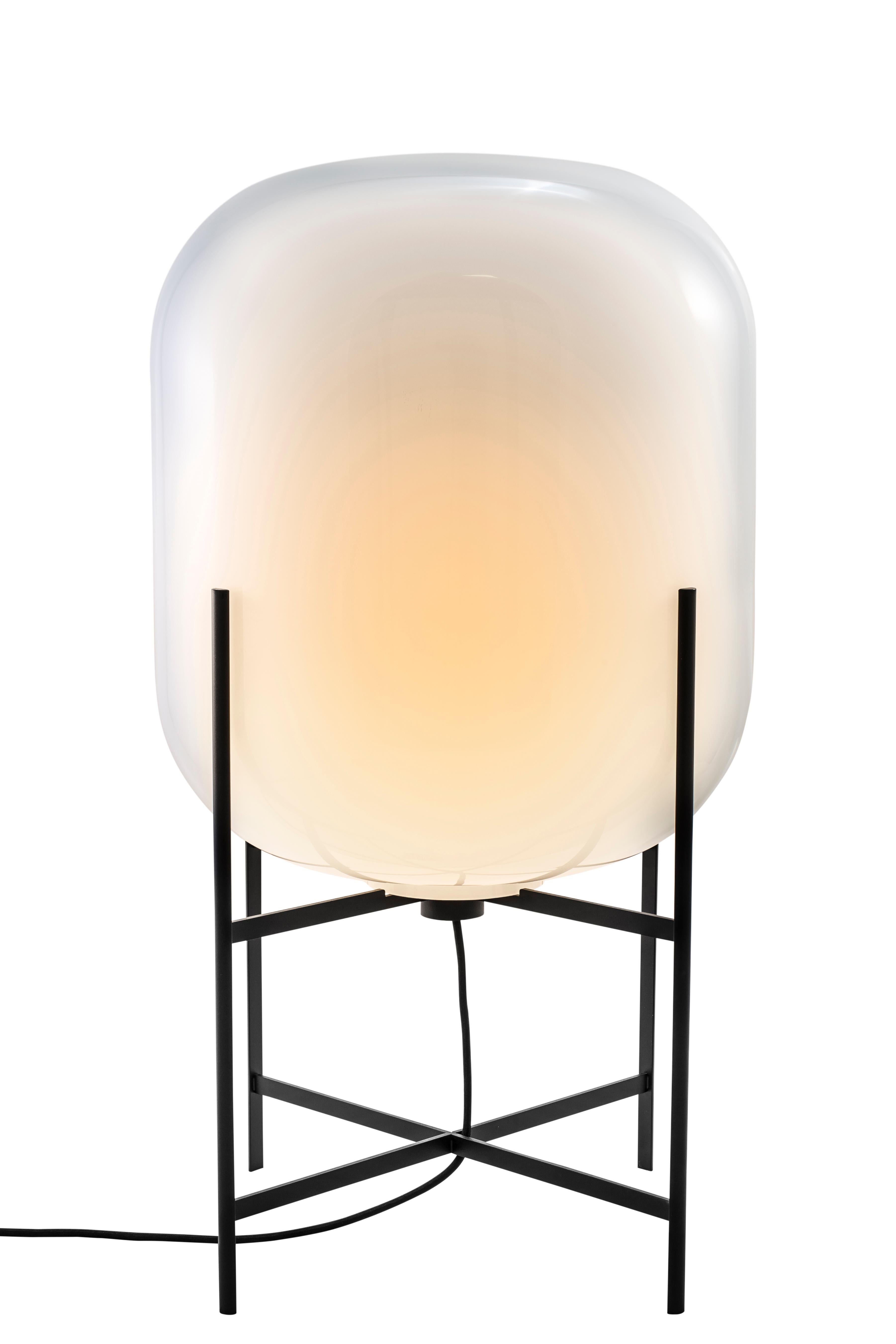 Oda medium white black floor lamp by Pulpo.
Dimensions: D45 x H80 cm.
Materials: handblown glass coloured and steel.

Also available in different finishes. 

A slender base hugs a bulbous form. An industrial motif softened by the gentle curves