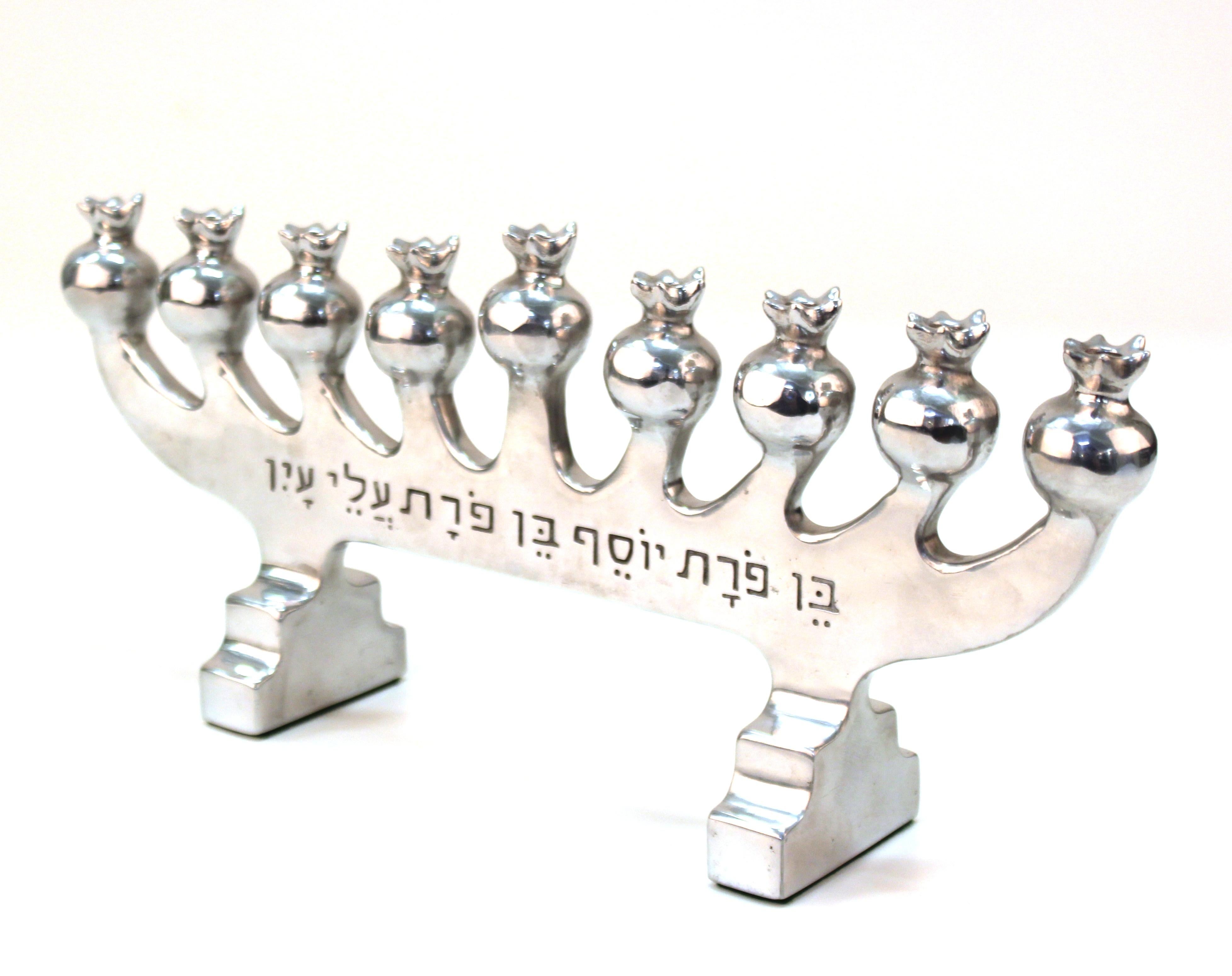 Modern cast aluminum menorah by Oded Halahmy, titled 'Chanukiah', created in 1991. Marked by the artist and dated on the side. In great vintage condition.