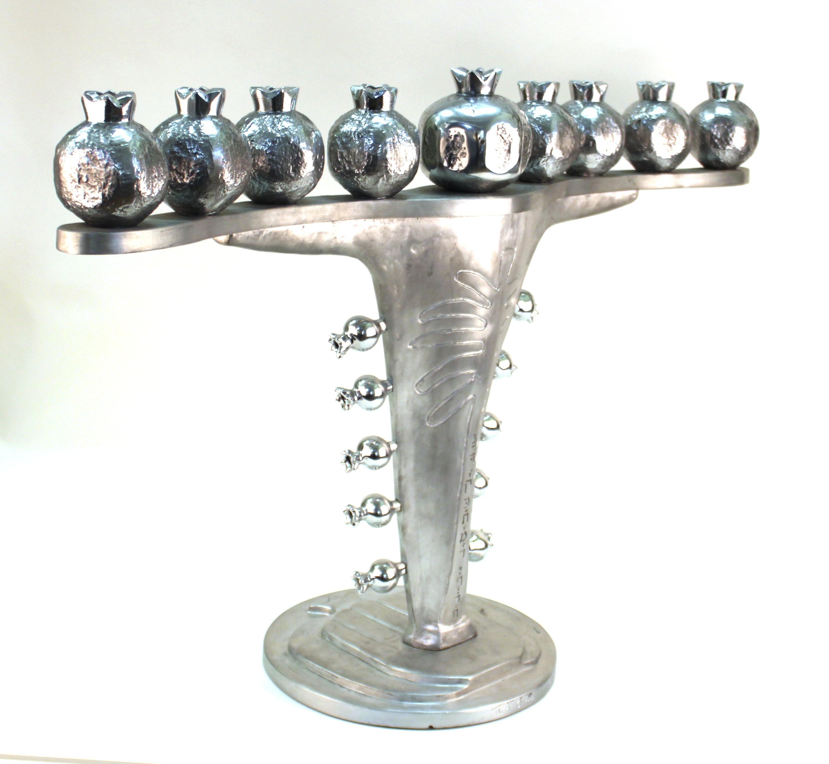 Modern cast aluminium menorah by Oded Halahmy, titled 'Happy Frond Lighting', created in 2005. Marked by the artist and dated on the base. In great vintage condition.