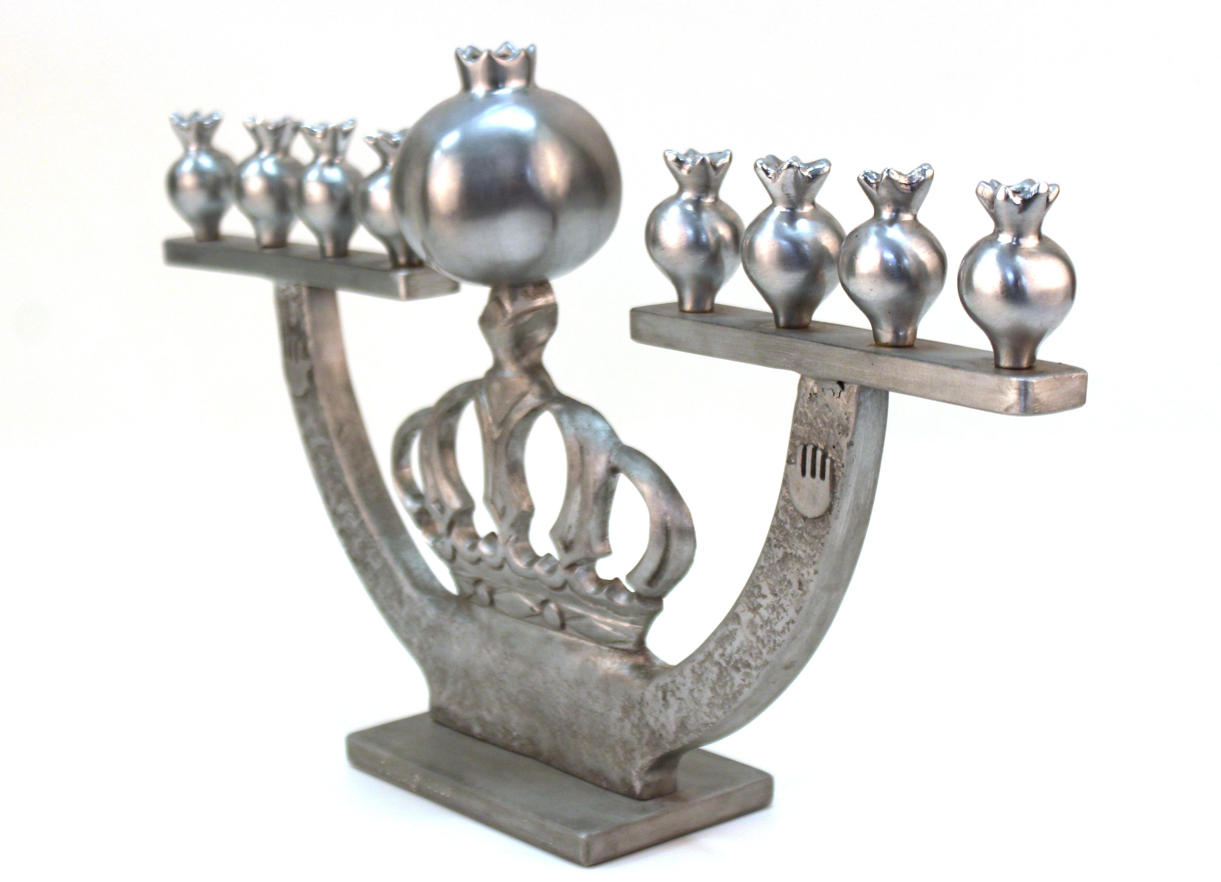 Modern cast aluminum menorah by Oded Halahmy, created in 2006. Marked by the artist and dated on the side. In great vintage condition.