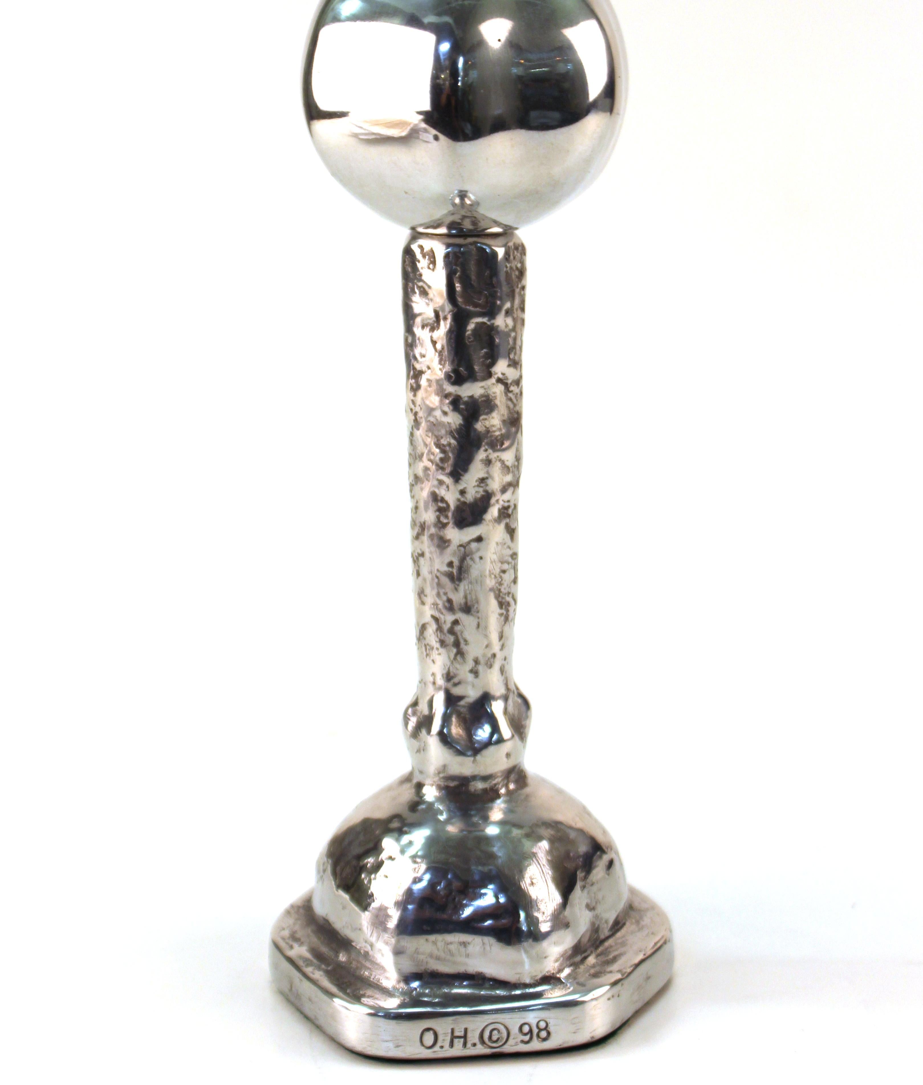 Oded Halahmy candlestick titled 'One Or Two' crafted in cast aluminum. The piece was produced in 1998. The piece remains in excellent vintage condition.