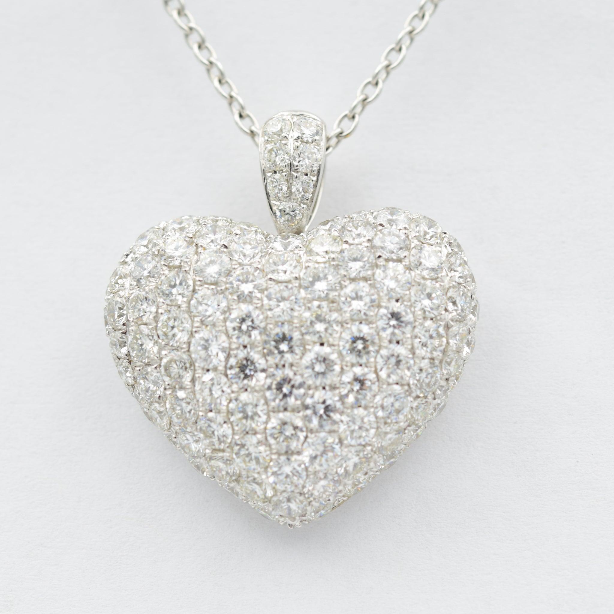 This beautiful diamond heart pendant by Odelia adds a little glamour to any outfit. It is crafted in 18k White Gold and contains 4.21 carats of dazzling diamonds. It is on a standard 18
