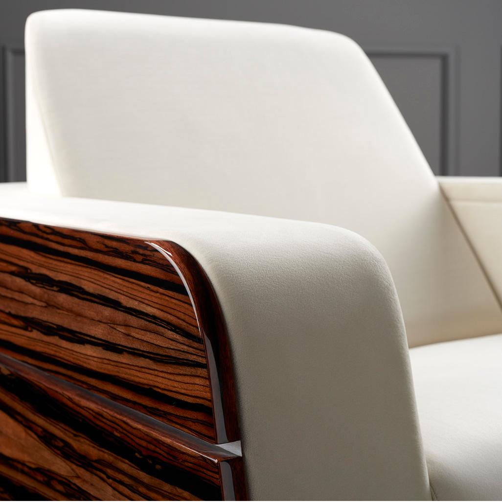 Odeon armchair single

The Odeon armchair is like a wide throne in the middle of a lecture hall, sitting in it you can feel as if you are in another world. Its futuristic shape is given by the curved shield shape of ebony Macassar veneer. The