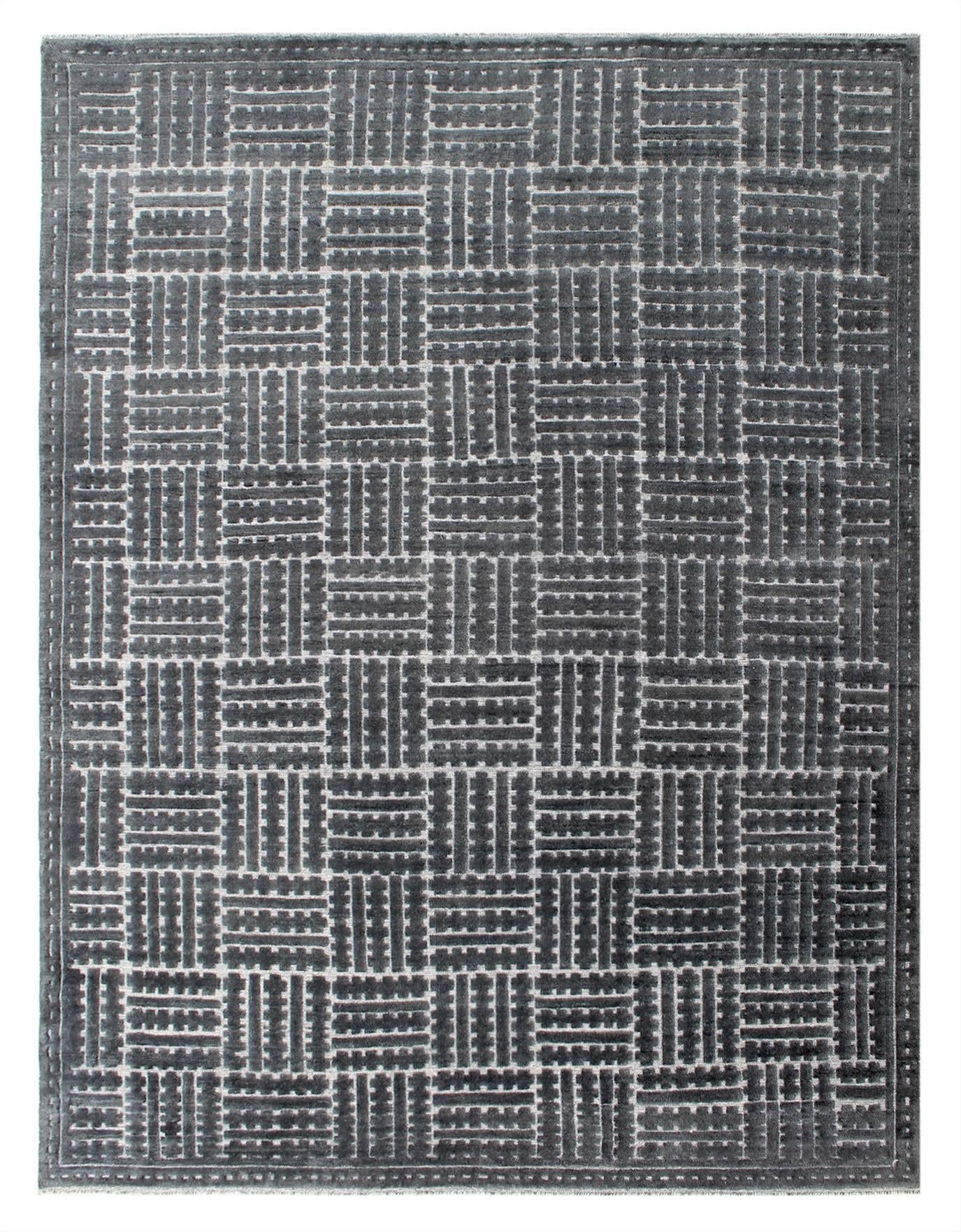 We love the way this rug uses the hand-knotted technique to create geometric shapes within the entirety of the rug. The balance of the cream lower pile makes this wool rug super comfy underfoot while being a nice statement piece in any room. It has