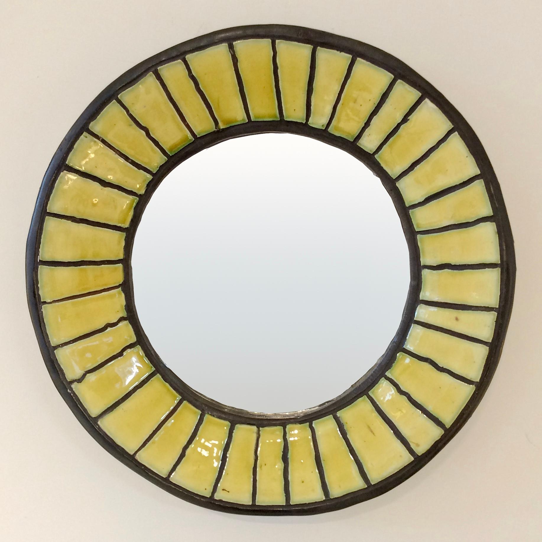 Rare Odette Dijeux circular round mirror, circa 1950, Belgium.
Enameled black and yellow ceramic. 
Signed on the back: Odette Dijeux.
Dimensions: 32 cm diameter, 5 cm D.
Original condition.
In the same spirit as the works of Georges Jouve,