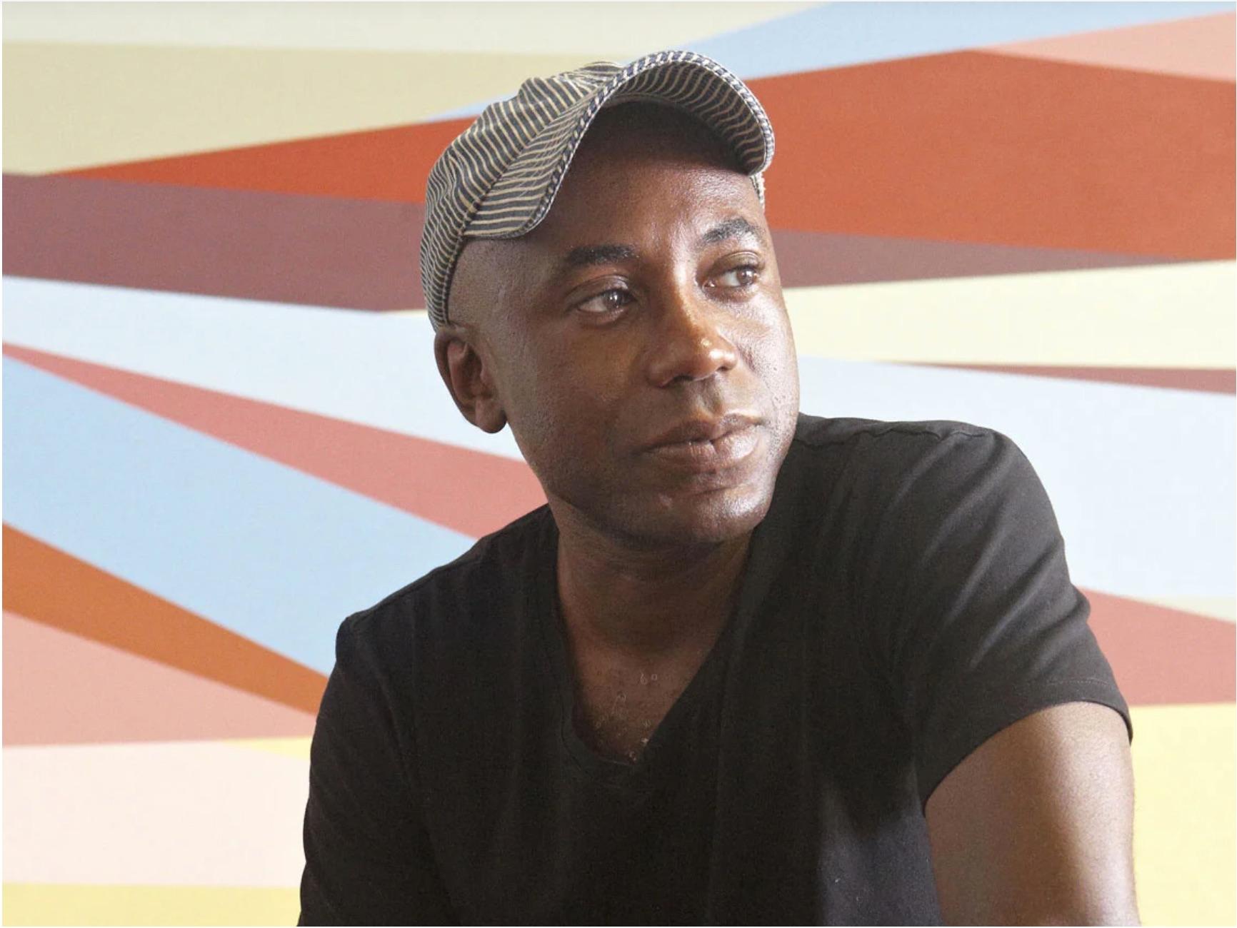 This is a limited edition signed, titled, and dated color lithograph #4/60, geometric abstraction, with predominant colors of pink, green, and blue. In his paintings, prints, and large-scale wall installations, Philadelphia-based Nigerian-American