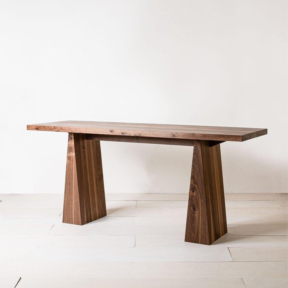 Odin Desk by Mythology
Dimensions: D 60 x W 165 x H 75 cm
Materials: Walnut.

Showcasing clean lines and a minimal, sculptural form, the Odin desk is inspired by the timeless simplicity of Modernist furniture design. The piece is handcrafted from