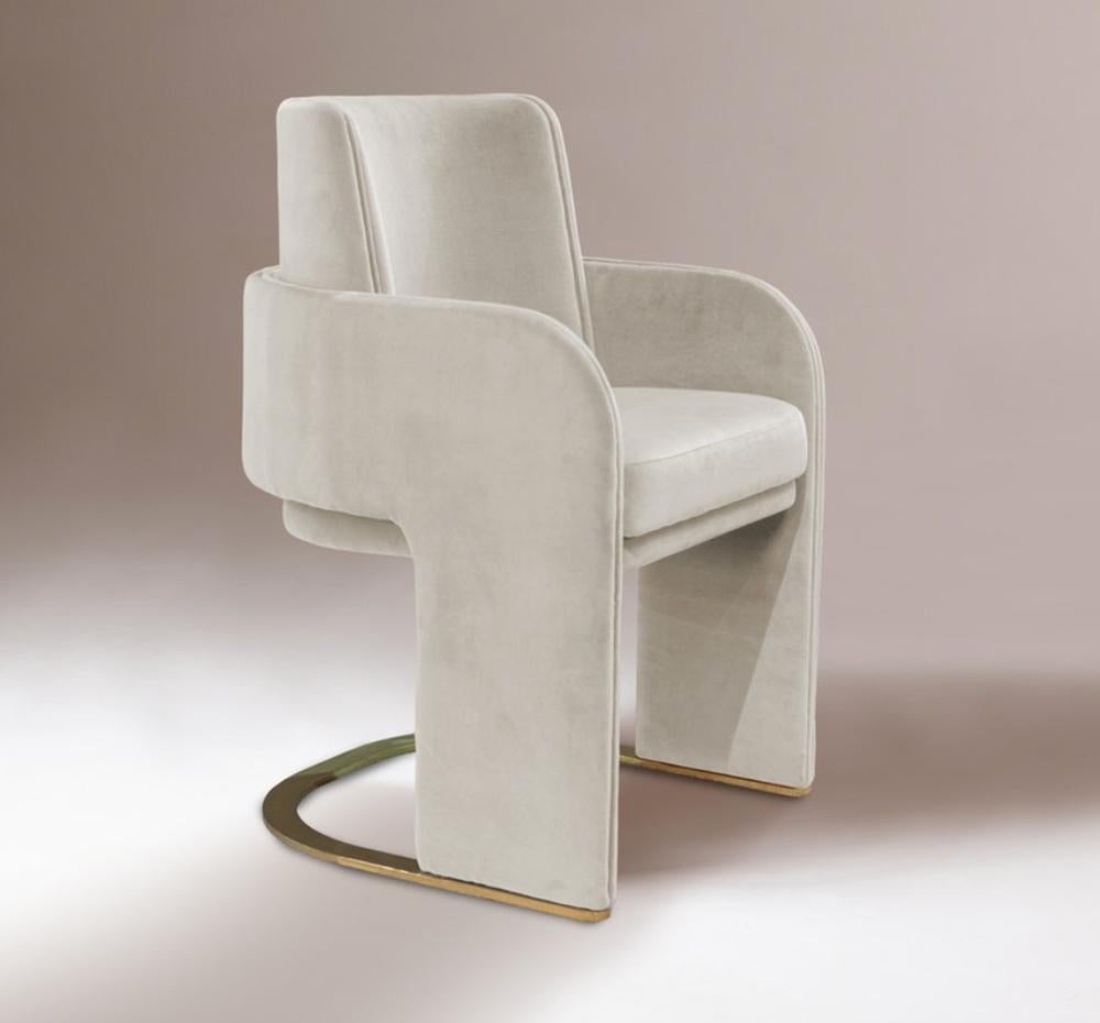 Dimensions: 
   w 56 cm  22”
   d 57 cm  23”
   h 85 cm  33”
   seat height: 48 cm  18”
   arm height: 65cm  26 “
Materials & Finishes: Base and feet in stainless steel plated polished or satin: brass, copper, or nickel. Upholstery: seat, armrests,
