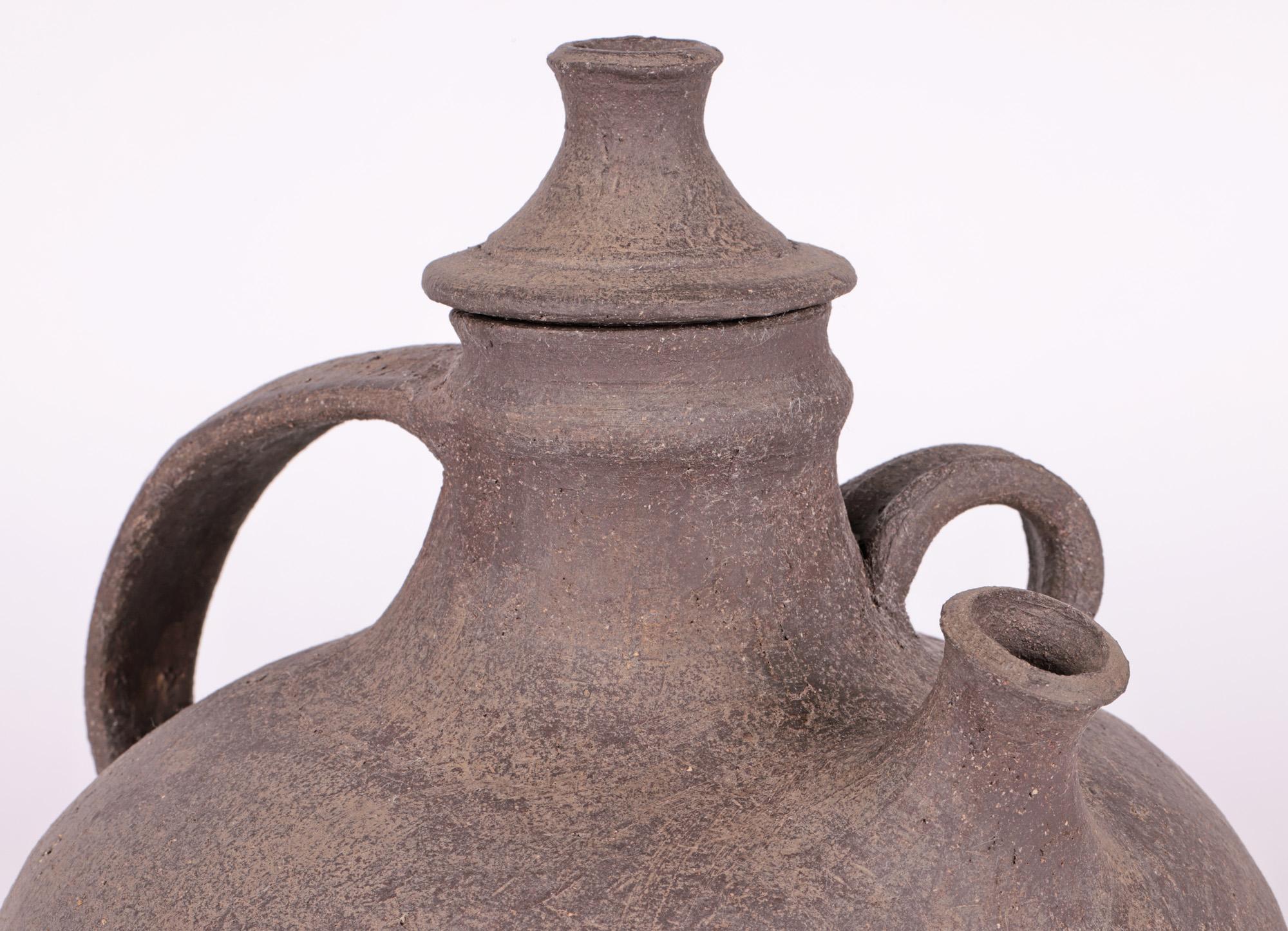 A large and stylish unusual Norwegian brutalist studio pottery lidded vessel in the form of a tea or water pot with makers marks ODK to the base and believed to date from the mid-20th Century or earlier. Similar in style to the work the Arnold Wiigs