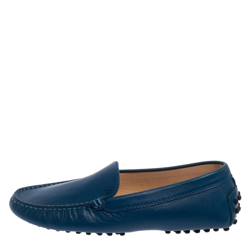 Sleek and luxe, these slip-on loafers by Tod's will enhance your outfits by giving them an edge. Meticulously crafted from leather, they carry fine stitching and round toes. The blue pair is complete with comfortable leather-lined insoles and