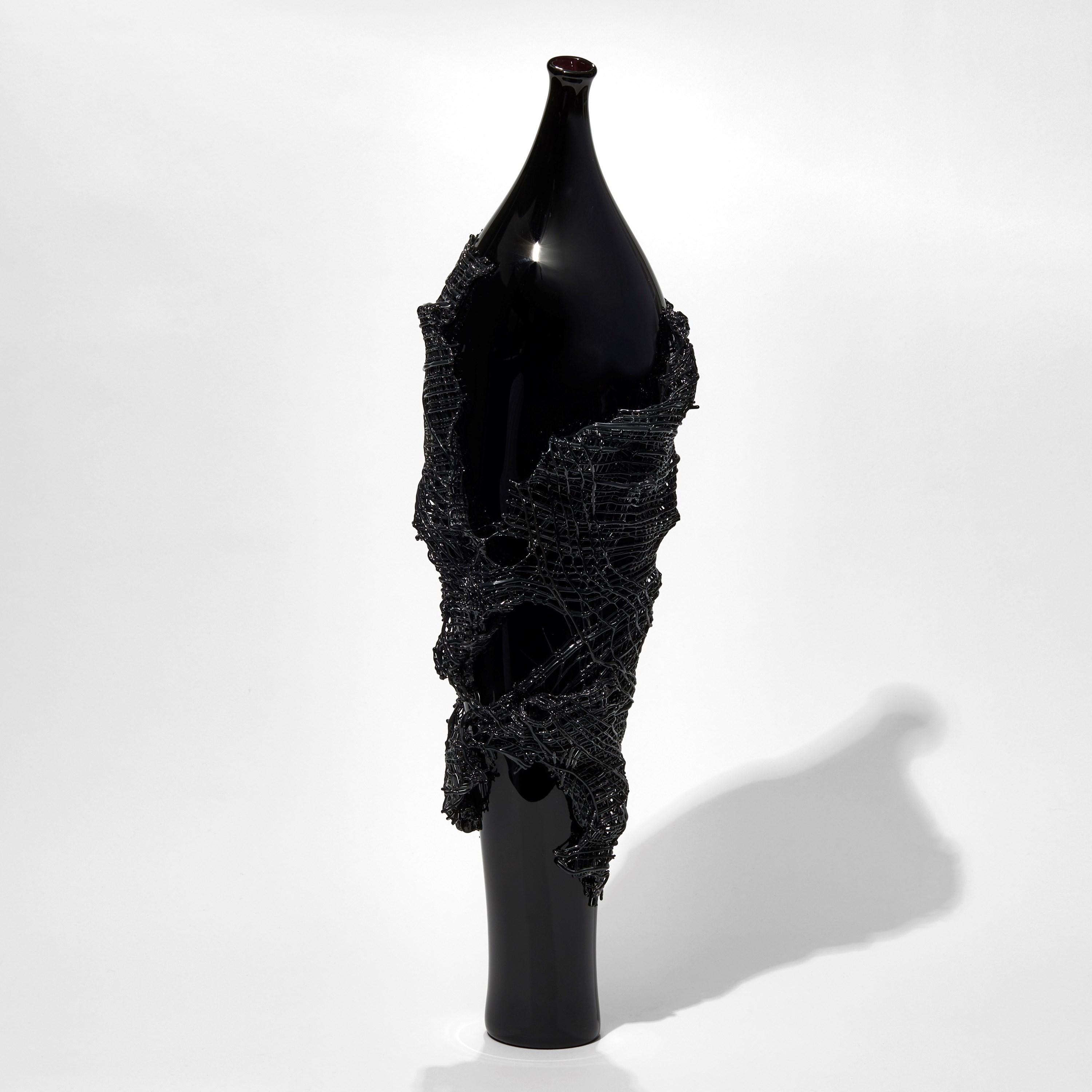 Odysseus, is a unique black glass sculpture by the British artist Cathryn Shilling. A handblown and free-form shaped glass sculpture with 'glass fabric' decoration worked onto the glass body while hot. A spectacular fusion of blown and kiln formed