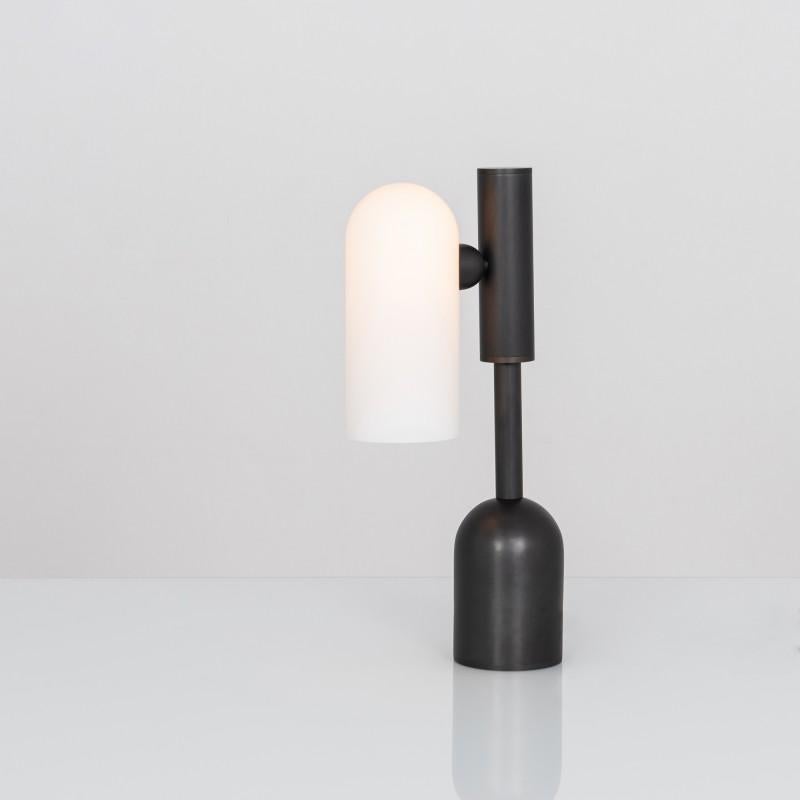 Odyssey 1 black table lamp by Schwung
Dimensions: W 10 x D 21 x H 44.6 cm
Materials: Black gunmetal, frosted glass

Finishes available: Black gunmetal, polished nickel, brass
 

 Schwung is a german word, and loosely defined, means energy or