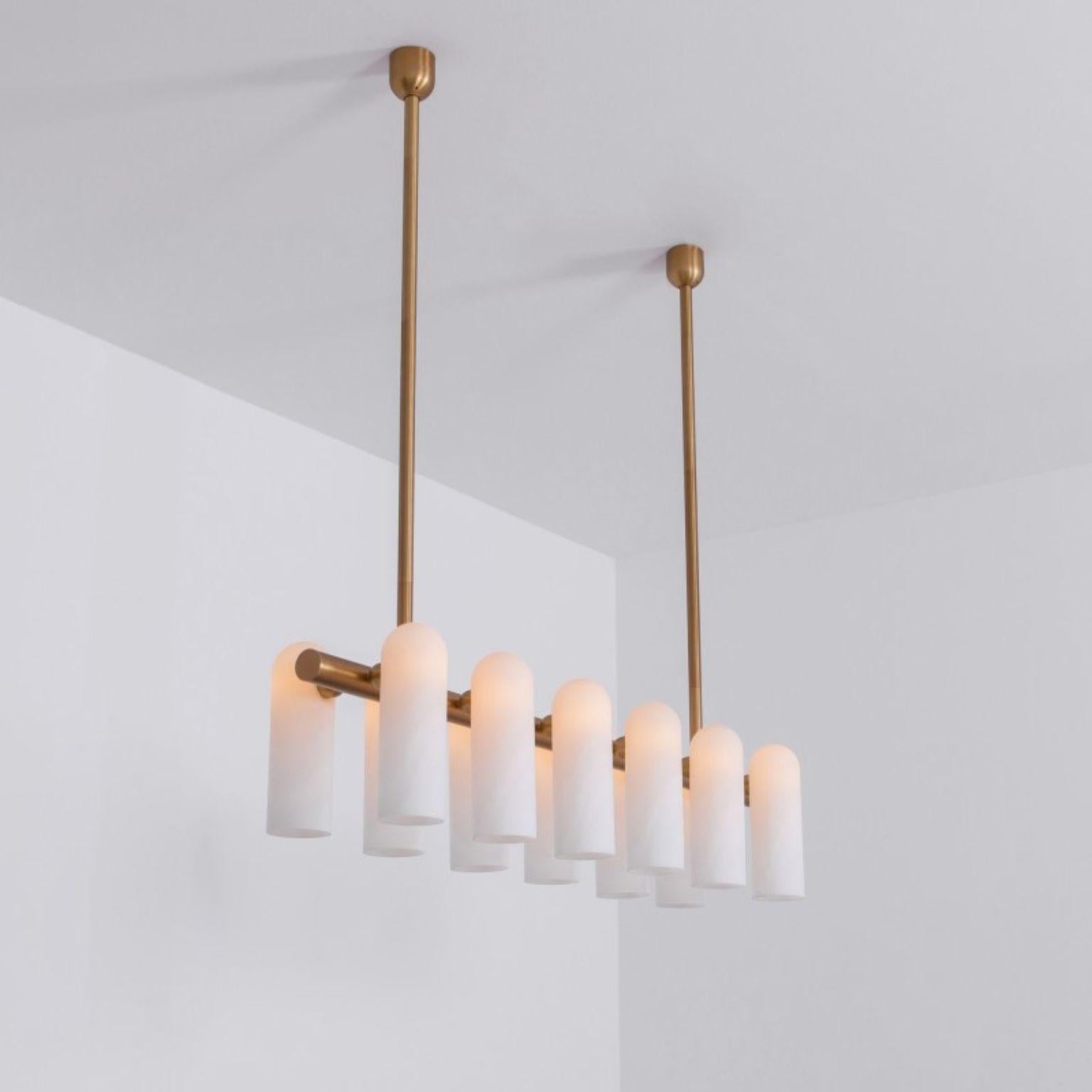 Odyssey Linear MD brass chandelier by Schwung
Dimensions: W 137 x D 31 x H 132 cm
Materials: Solid brass, frosted glass

Finishes available: Black gunmetal, polished nickel
  

 Schwung is a german word, and loosely defined, means energy or