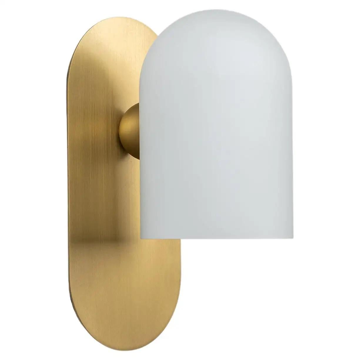 Brass small sconce by Schwung.
Dimensions: W 10.5 x D 14 x H 23 cm
Materials: brass, frosted glass.

Finishes available: black gunmetal, polished nickel, brass.


Schwung is a German word, and loosely defined, means energy or momentumm of a