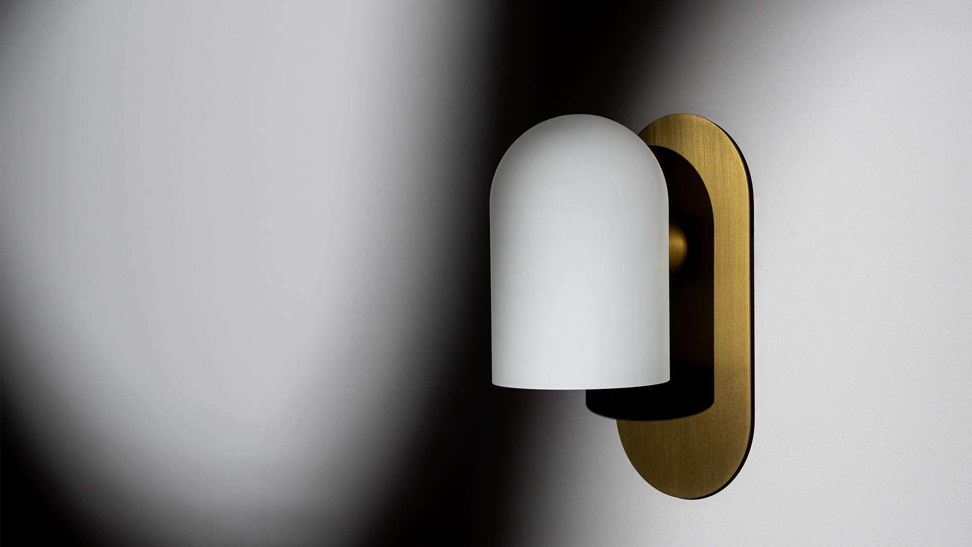 Serenely emitting light, while projecting its form. The distinctive Odyssey globe is reflected in this fixture by a rounded brass wall plate, spreading a diffuse glow.

Available in our three signature finishes: Lacquered Burnished Brass (LBB);