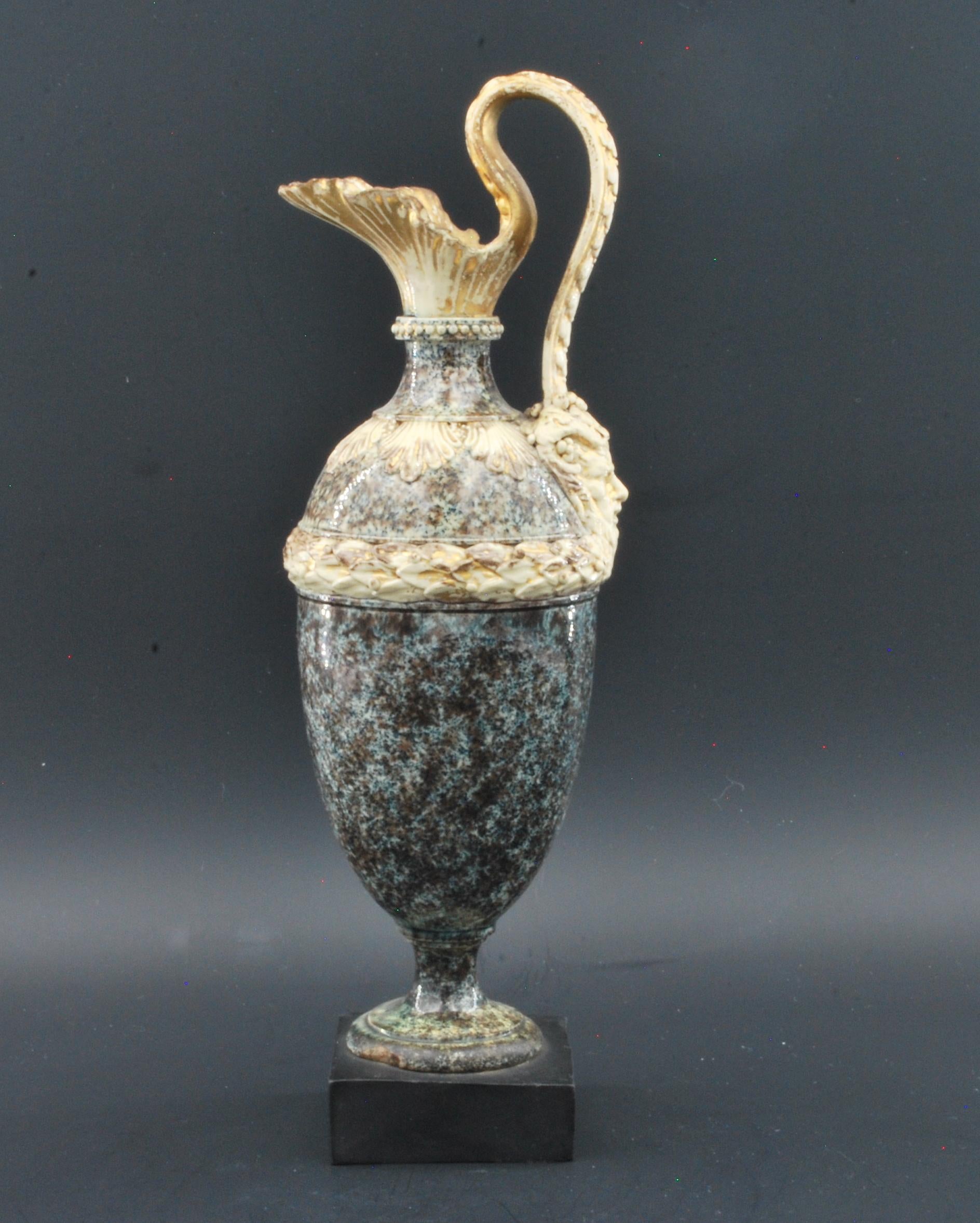 A splendid miniature oenochoe in creamware, decorated to simulate porphyry. Much of the original gilding still remains; all too often gilding from this period has worn off, or has been over-restored.
 
Exhibited: Wedgwood, Master Potter to the
