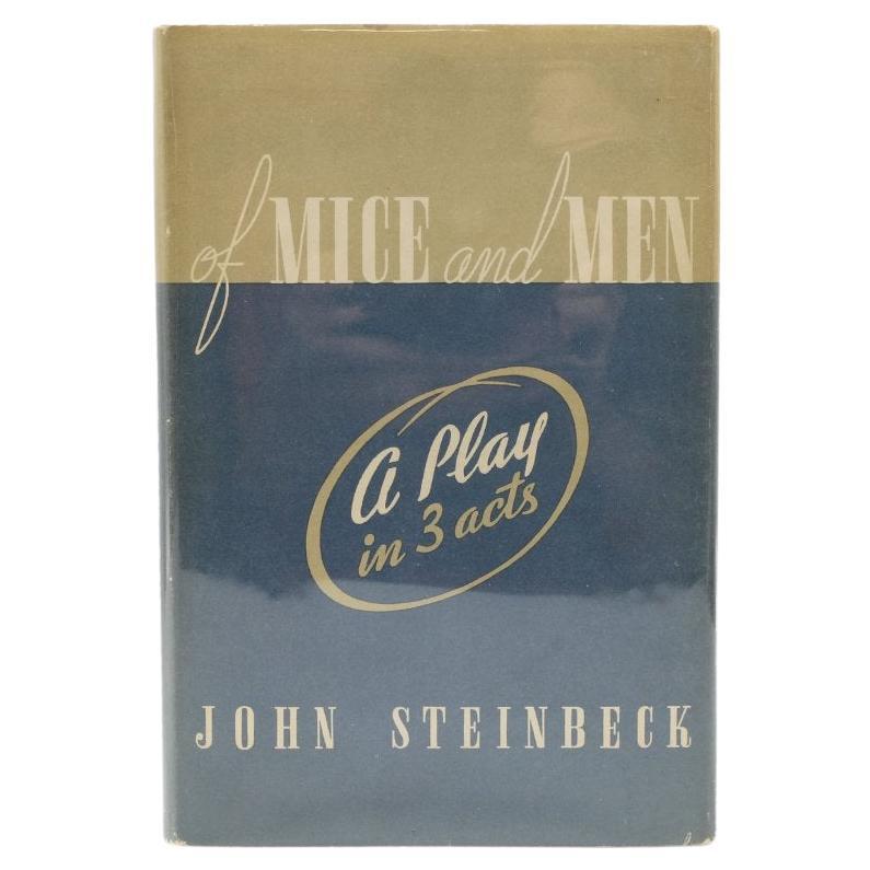 Steinbeck, John. Des souris et des hommes : Une pièce en trois actes. New York : Convici Friede, Publishers, 1937. Première édition. Octavo. Carton d'origine de l'éditeur en toile beige, avec des titres noirs et bruns sur le devant et au dos,