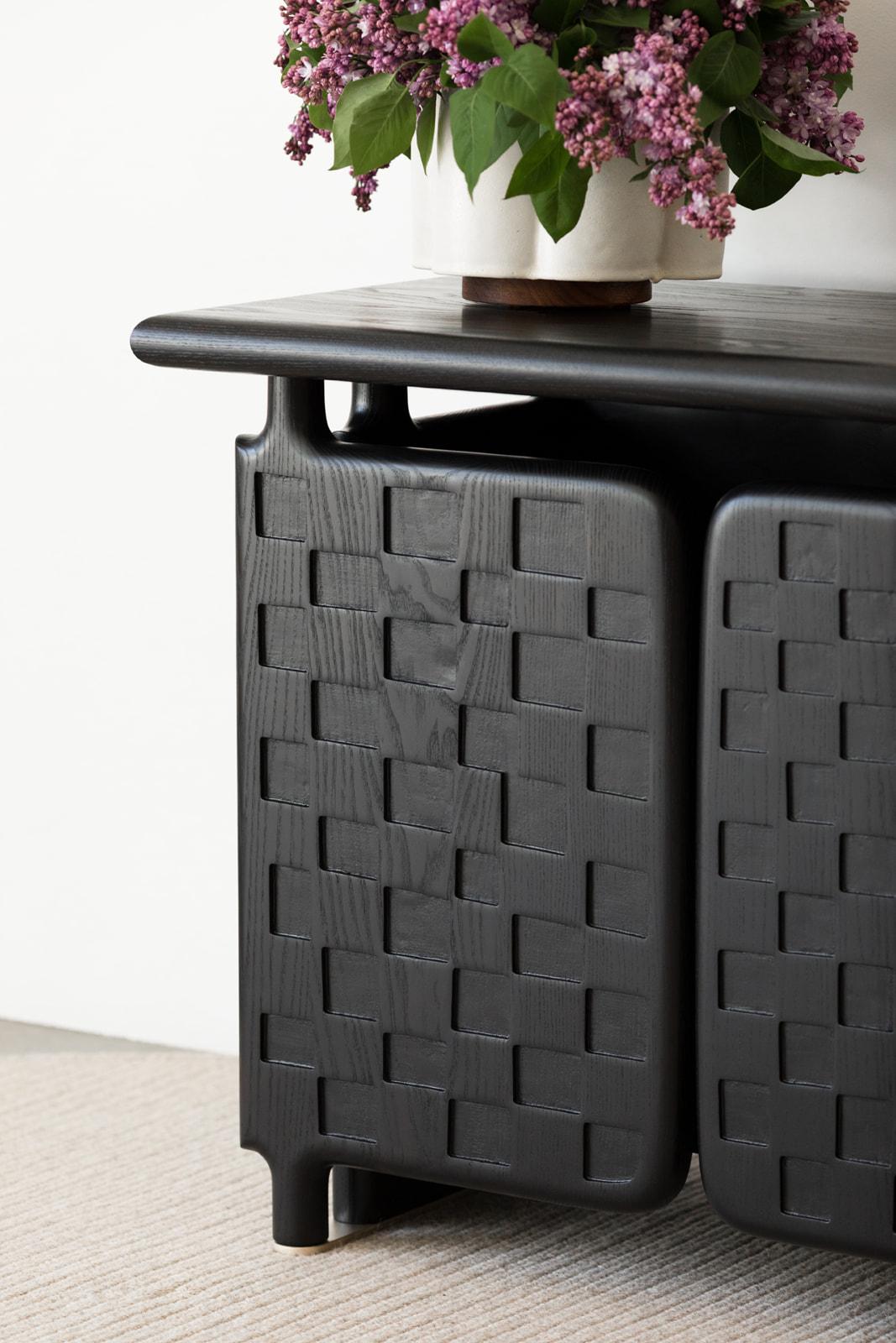 Our Off-Grid Credenza takes inspiration from the distinctive checkerboard pattern and functional pivot hinge of a Door for an Inner Room made in the late 19th century by an unnamed Baule artist in what is now the Ivory Coast.

With the check pattern