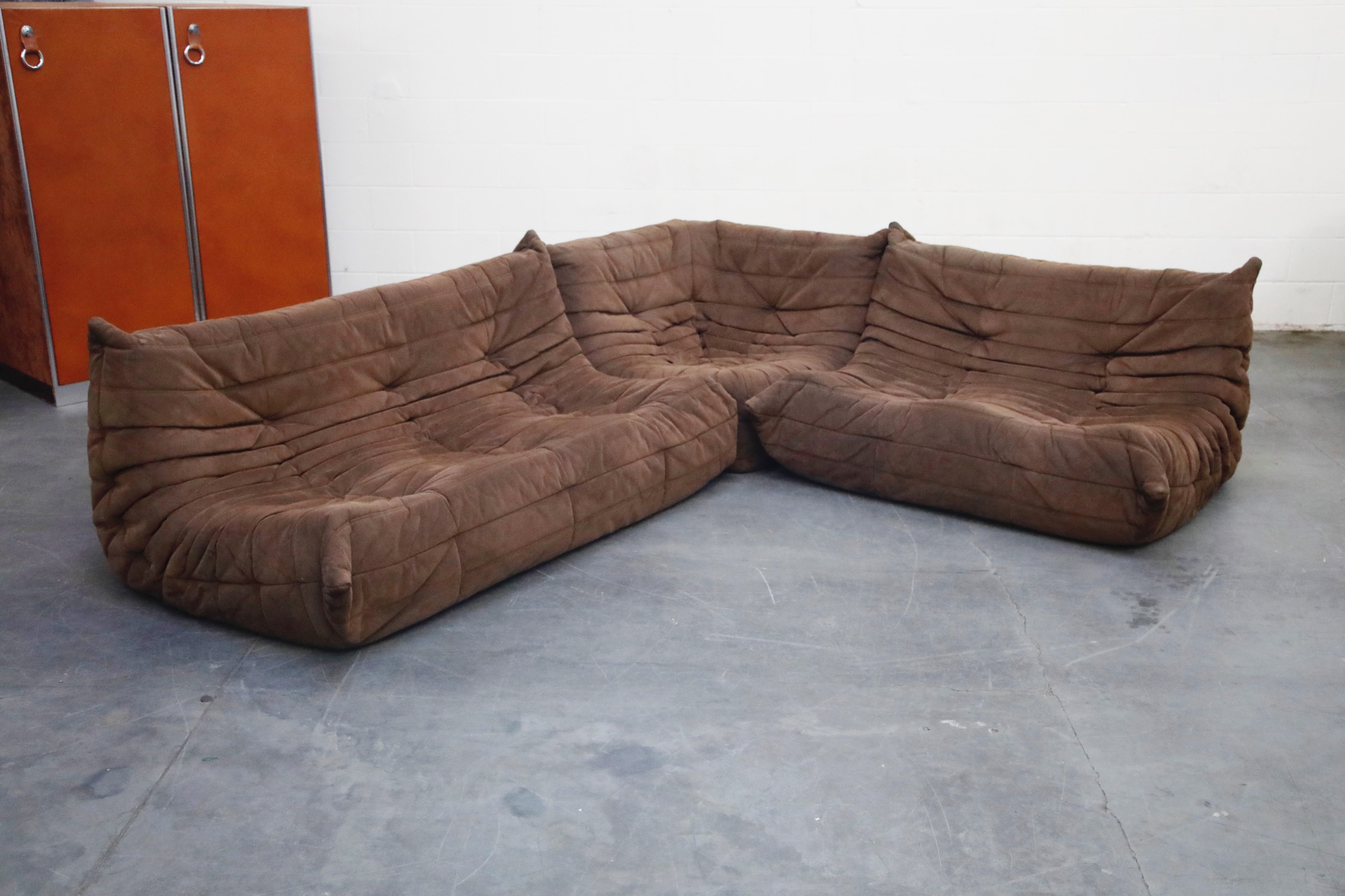 This incredible five (5)-piece Togo sectional living room set, was designed by Michel Ducaroy in 1973 for Ligne Roset, France. Signed with Ligne Roset underside decking fabric and labels on each piece. Originally designed in the 1970s, this set