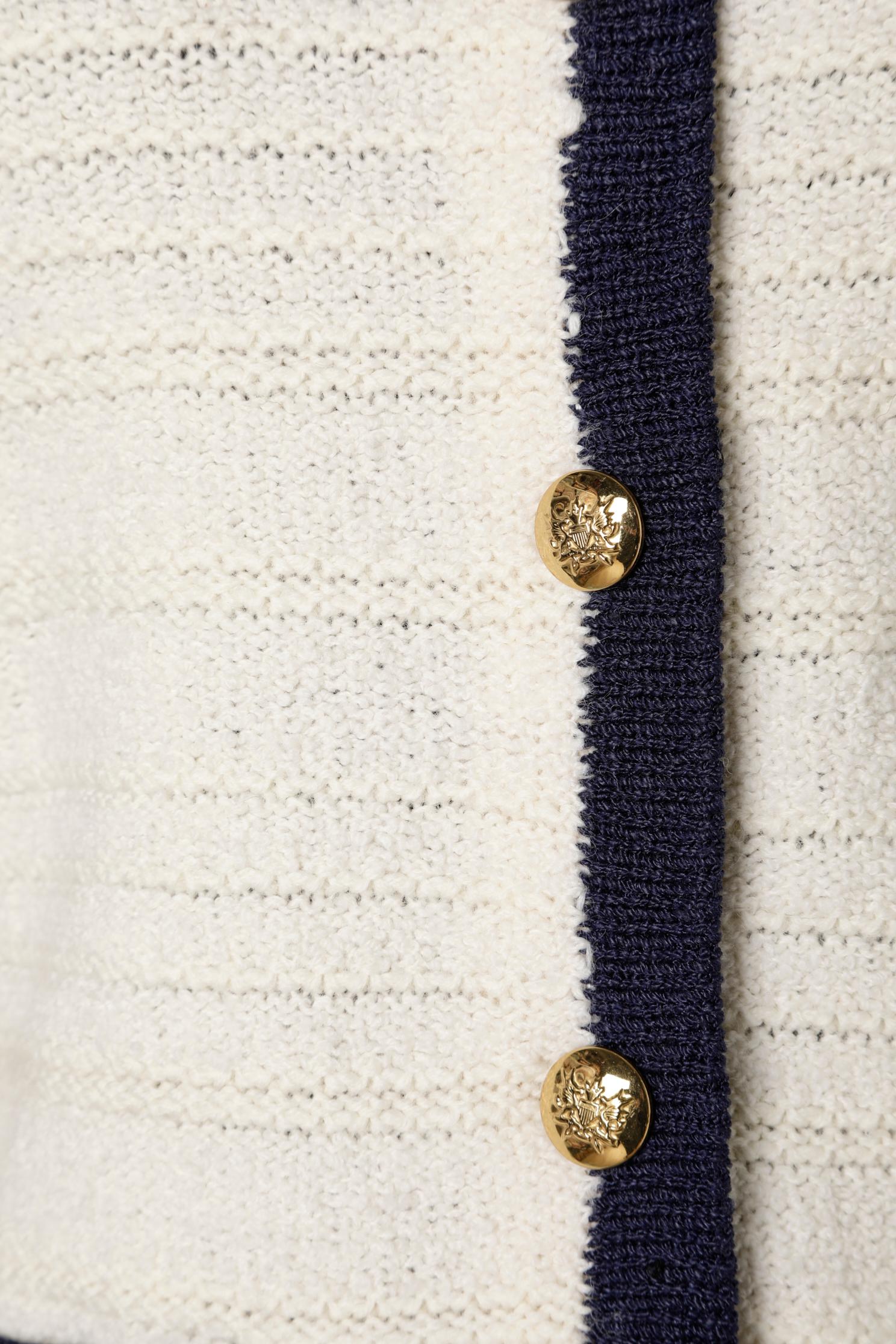 Off-white and navy knit cardigan with anchor and gold metal buttons. 