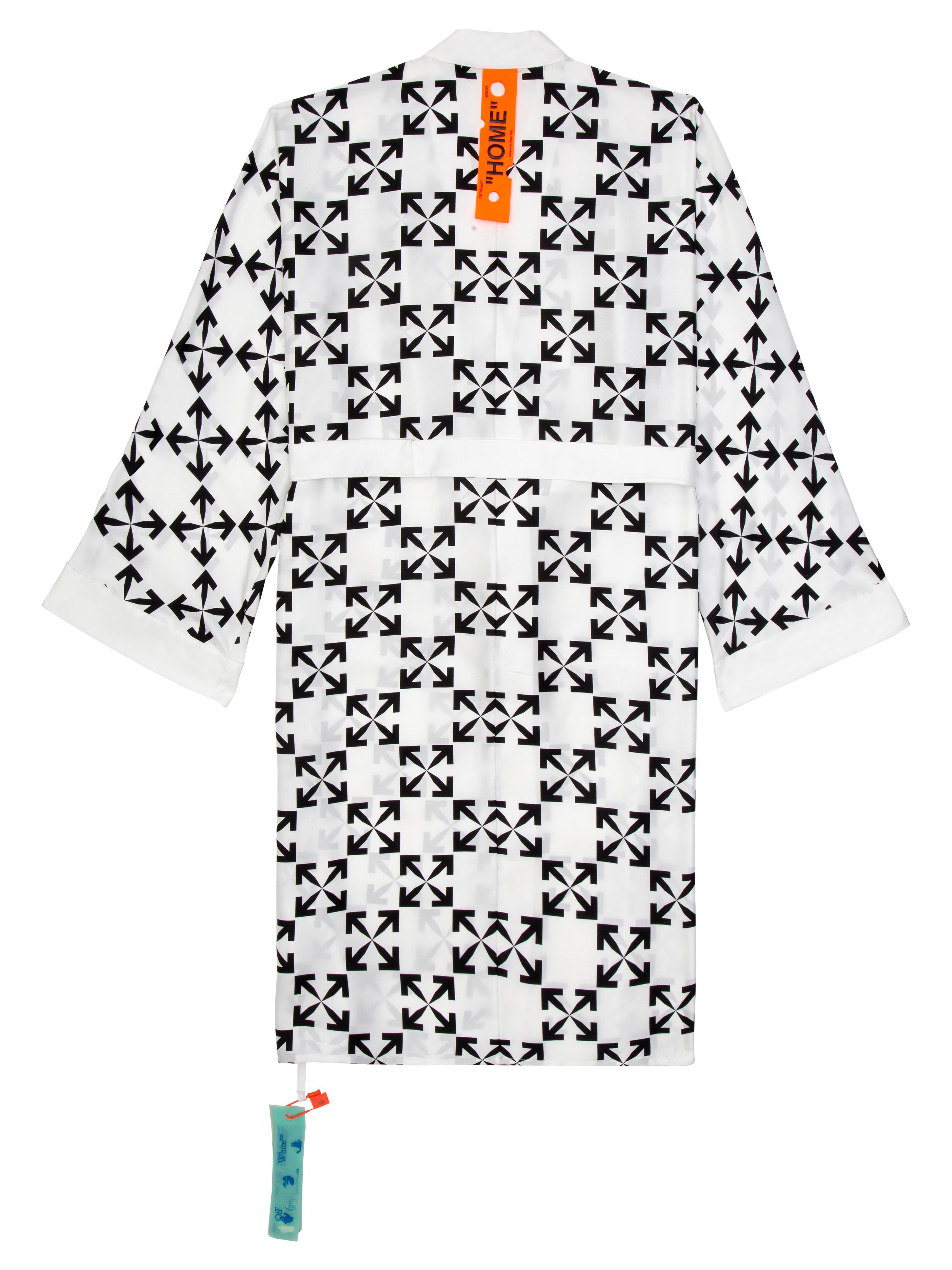 Silk Robe with belt in black arrow pattern on a white base. HOME orange loop on the back.
By Virgil Abloh
Size: Small
This item is only available to be purchased and shipped to the United States.
  