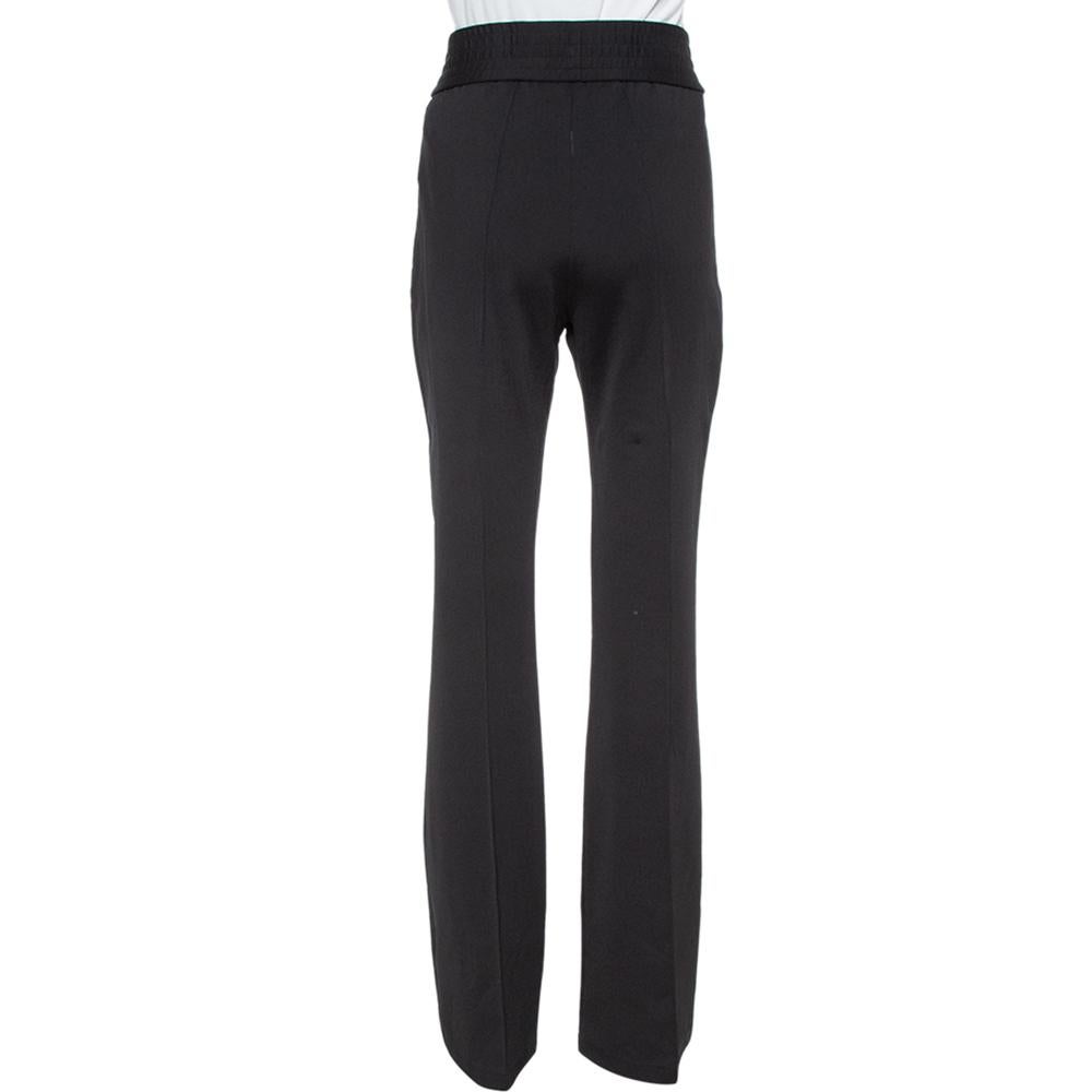 These track pants from Off-White are trendy and minimally stylish. They are made of a stretch knit fabric and designed in a flared silhouette. They are equipped with two pockets and will surely lend you a great fit. They'll look best with simple