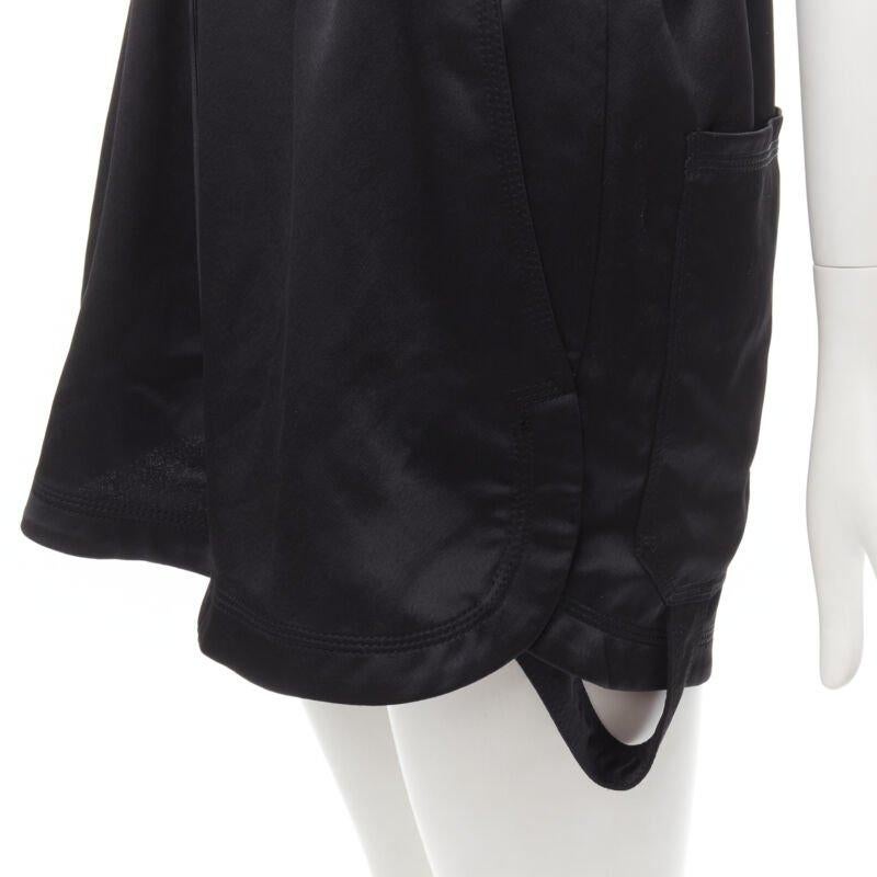 OFF WHITE C/O VIRGIL ABLOH black logo mechanic pocket boxy romper IT40 S
Reference: CAWG/A00237
Brand: Off White
Designer: Virgil Abloh
Material: Polyester
Color: Black
Pattern: Solid
Closure: Button
Lining:  Unlined
Extra Details: Drawstring at