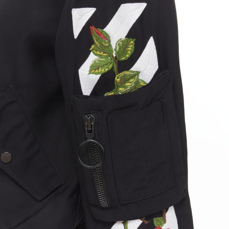 OFF WHITE C/O VIRGIL ABLOH black rose floral embroidery logo bomber jacket XS
Reference: KNLM/A00058
Brand: Off White
Designer: Virgil Abloh
Material: Nylon
Color: Black, Red
Pattern: Floral
Closure: Zip
Lining:  Nylon
Extra Details: Large hoop