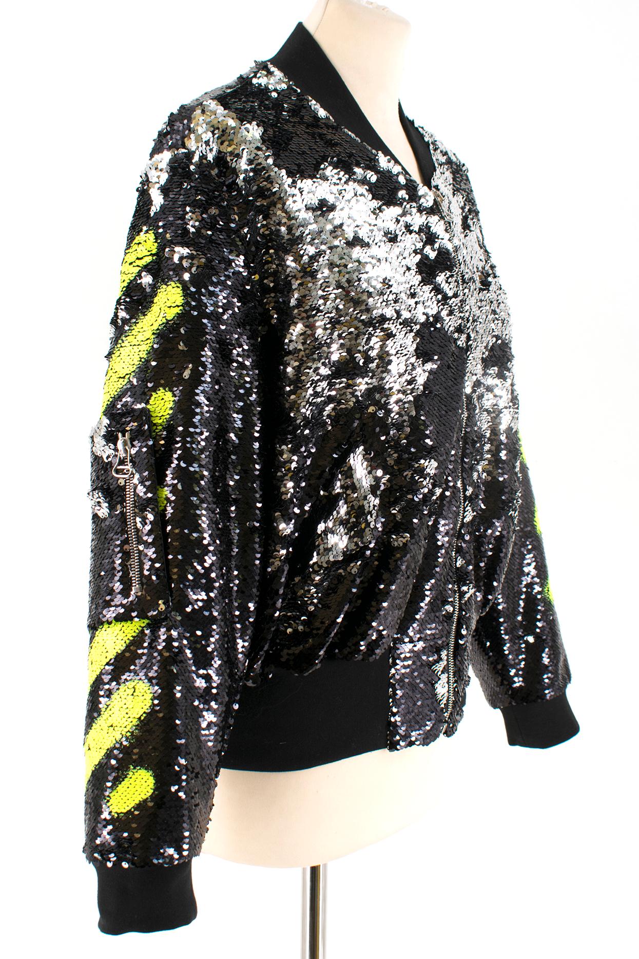 Off-White C/O Virgil Abloh Black Sequin Bomber Jacket

Sequin jacket 
Logo design in painted neon green sequins 
Double sided sequins black/silver
Ribbed black hems, sleeve cuffs and neck line
exterior pockets on either side of jacket with snap