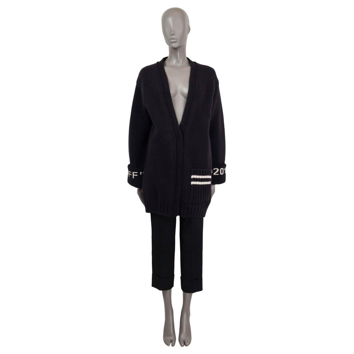 100% authentic Off-White 2013 v-neck knit cardigan in black and white wool (72%) and polyamide (28%). Features a patch pocket on the front and the logo embroidered at the cuffs. Opens with concealed push buttons on the front. Unlined. Has been worn