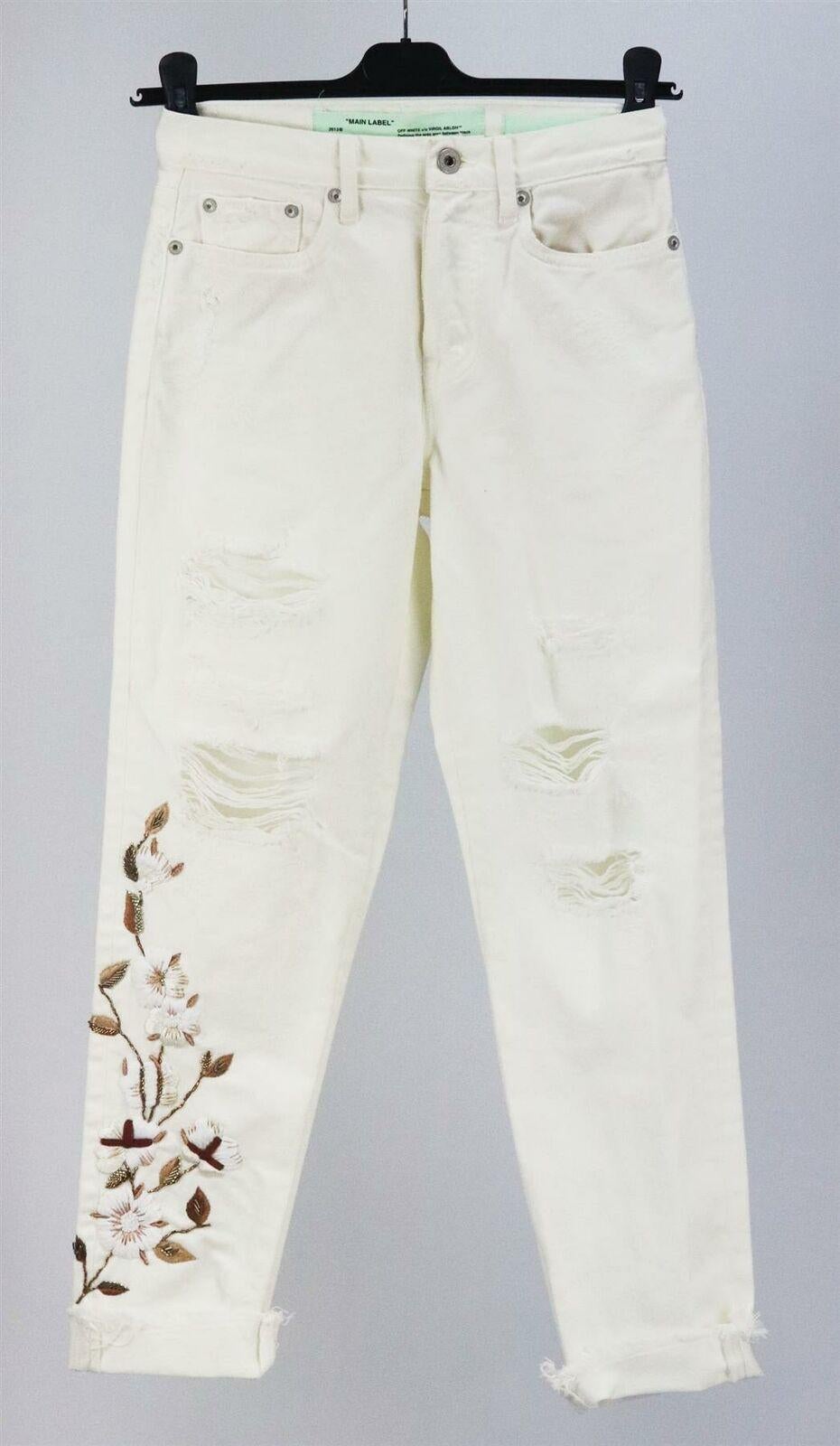Off-White's high-rise jeans are made from printed cotton and embroidered with blossom detail down one leg, they fall to a straight-leg silhouette and look especially cool cuffed.
White denim.
Button and concealed zip fastening at the front.
100%