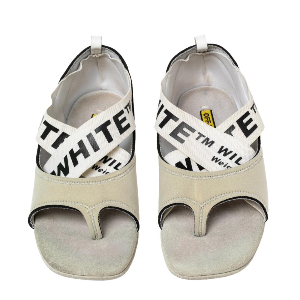 Crafted using grey fabric and set on rubber soles, these Off-White Yoga flats are detailed with branded straps laid in a criss-cross manner on the uppers. The flats are about comfort and effortless style.

Includes: Original Box
