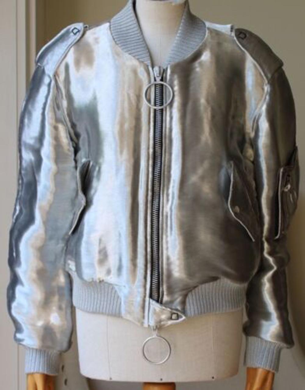 Perfectly in tune with fashion's streetwear moment, this padded silver bomber jacket is cut in a relaxed silhouette and finished with the brand's chunky silver zip and ribbed trims. Silver taffeta. Two-way zip fastening through front. 59% viscose,