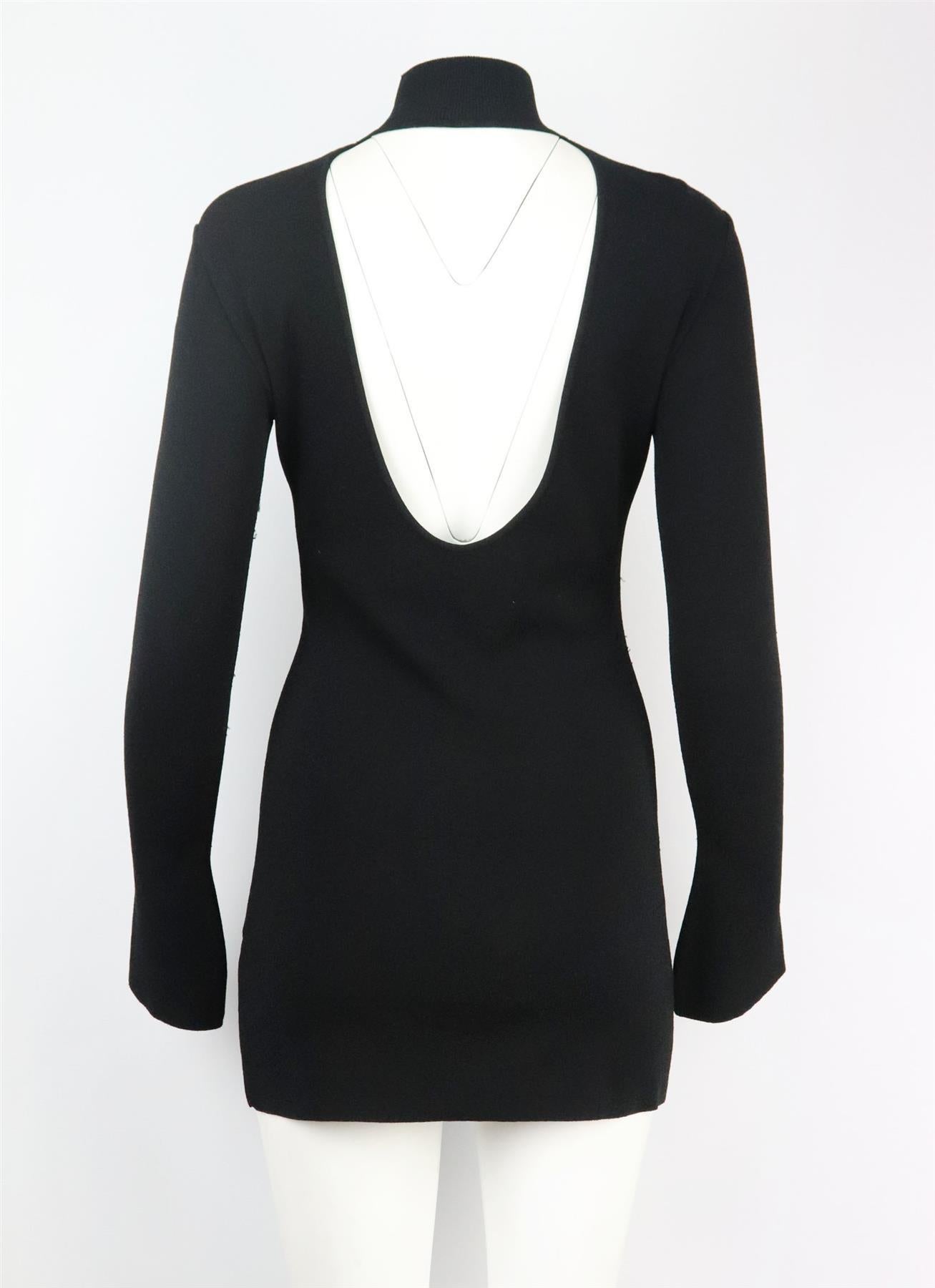 This turtleneck mini dress by Off-White is made from black stretch-knit and has a close, figure-hugging fit, it has a logo-intarsia detail on the front and turns to reveal an open back. Black viscose-blend. Slips on. 79% Viscose, 21% polyester.