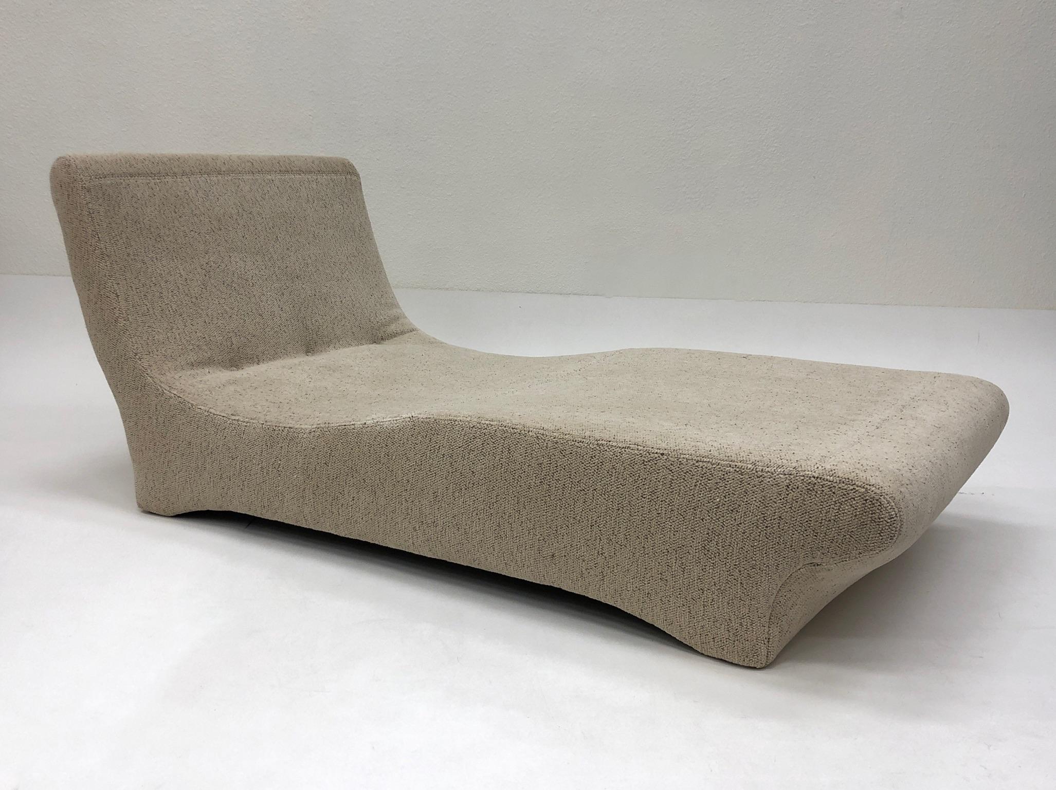 A glamorous sculptural chaise design by Preview in the 1990s.
The chaise has been newly recovered in soft off-white chenille fabric with some light brown threads (see detail photos).
Dimension: 64” deep, 32” wide, 32” high, 20” seat.