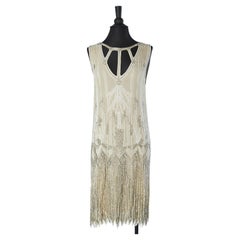 Off- White cocktail dress with white and silver beadwork  Circa 1925