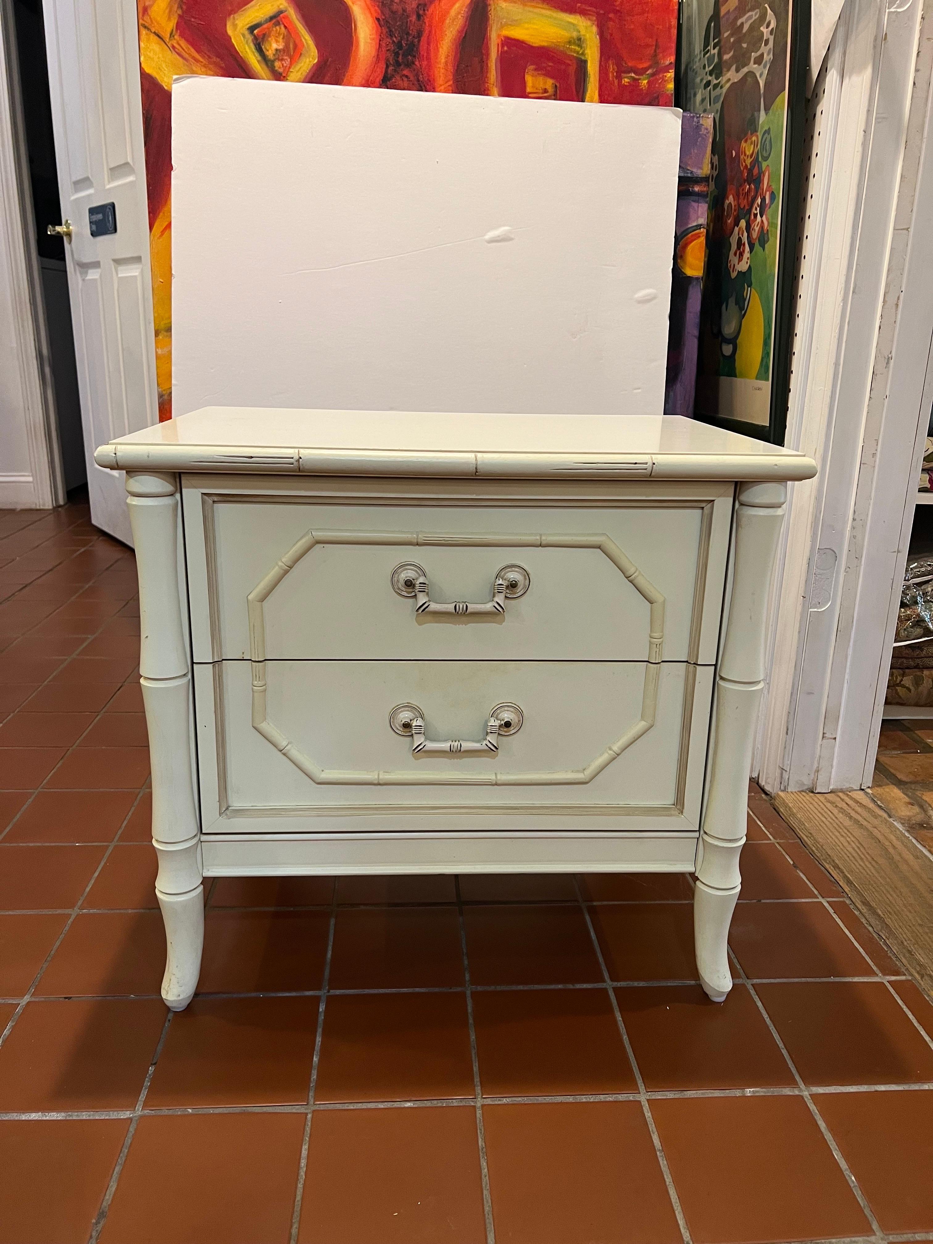 Broyhill Buttercream faux bamboo nightstand. Classic two drawer stand with laminate top. Nice decorative handles.
 