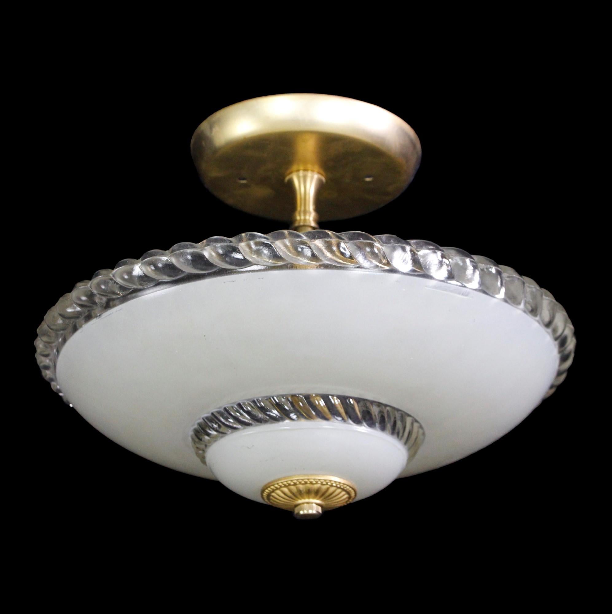 1940s white and clear glass flush mount light with a bright brass finial and fitter. Price includes restoration. This can be seen at our 400 Gilligan St location in Scranton, PA.