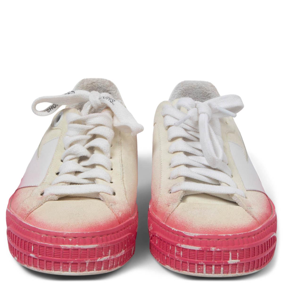 100% authentic OFF-WHITE Arrow low top sneakers in ivory distressed suede with white leather arrow and pink spray paint on the rubber sole. Have been worn and are in excellent condition. 

Measurements
Imprinted Size	37 (run big)
Shoe Size	38
Inside