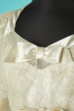 Off-white lace and satin bow wedding dress Circa 1930's