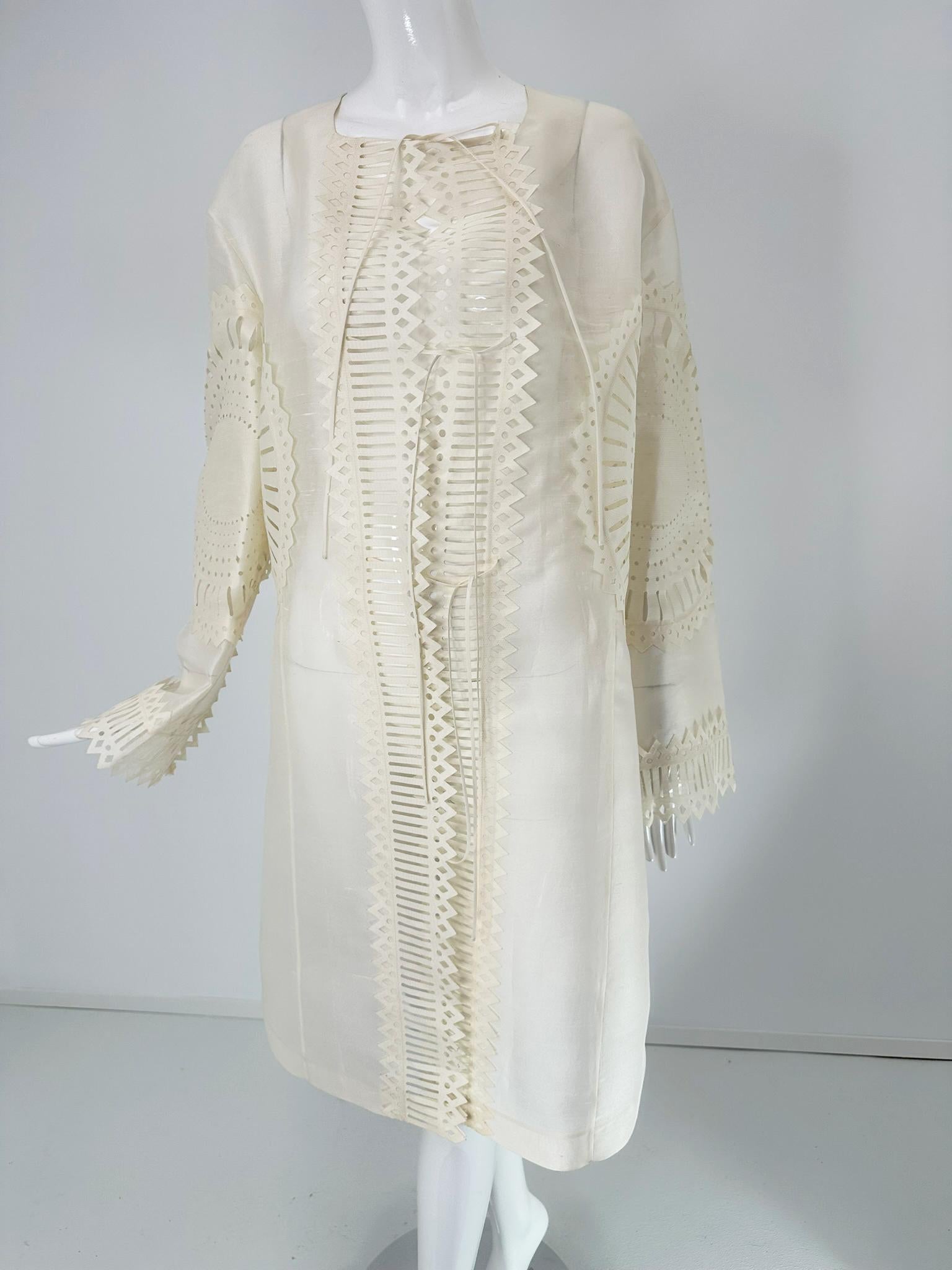 Off white laser cut lace sheer silk blend, feels like silk organza, art to wear tie front coat fits like a medium-large. Unique and perfect for any special occasions. Long frull sleeve coat with an oval neckline, the front facings are laser cut in