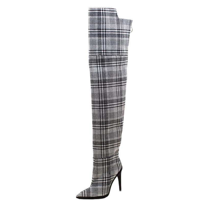 Perfect for the winter season, these Off-White over-the-knee boots are going to be your best buy. Crafted in black and white tartan plaid fabric, they feature pointed toes and 10.5 cm heels. They also feature an asymmetric topline and come equipped