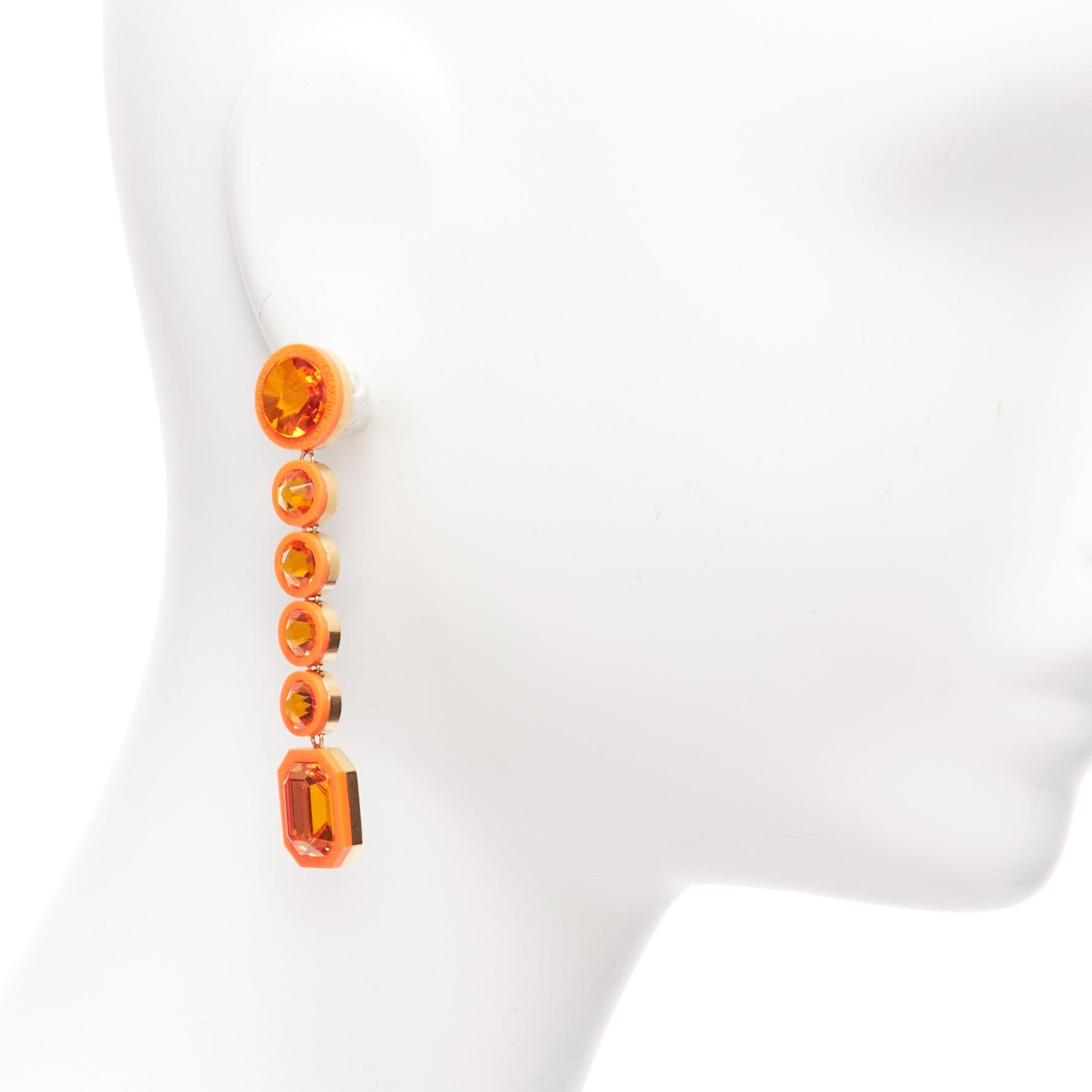 OFF WHITE neon orange gold logo jewel rhinestone drop pin earrings pair
Reference: AAWC/A00897
Brand: Off White
Material: Metal, Acrylic
Color: Orange, Gold
Pattern: Crystals
Closure: Pin
Lining: Gold Metal
Made in: Italy

CONDITION:
Condition: Very